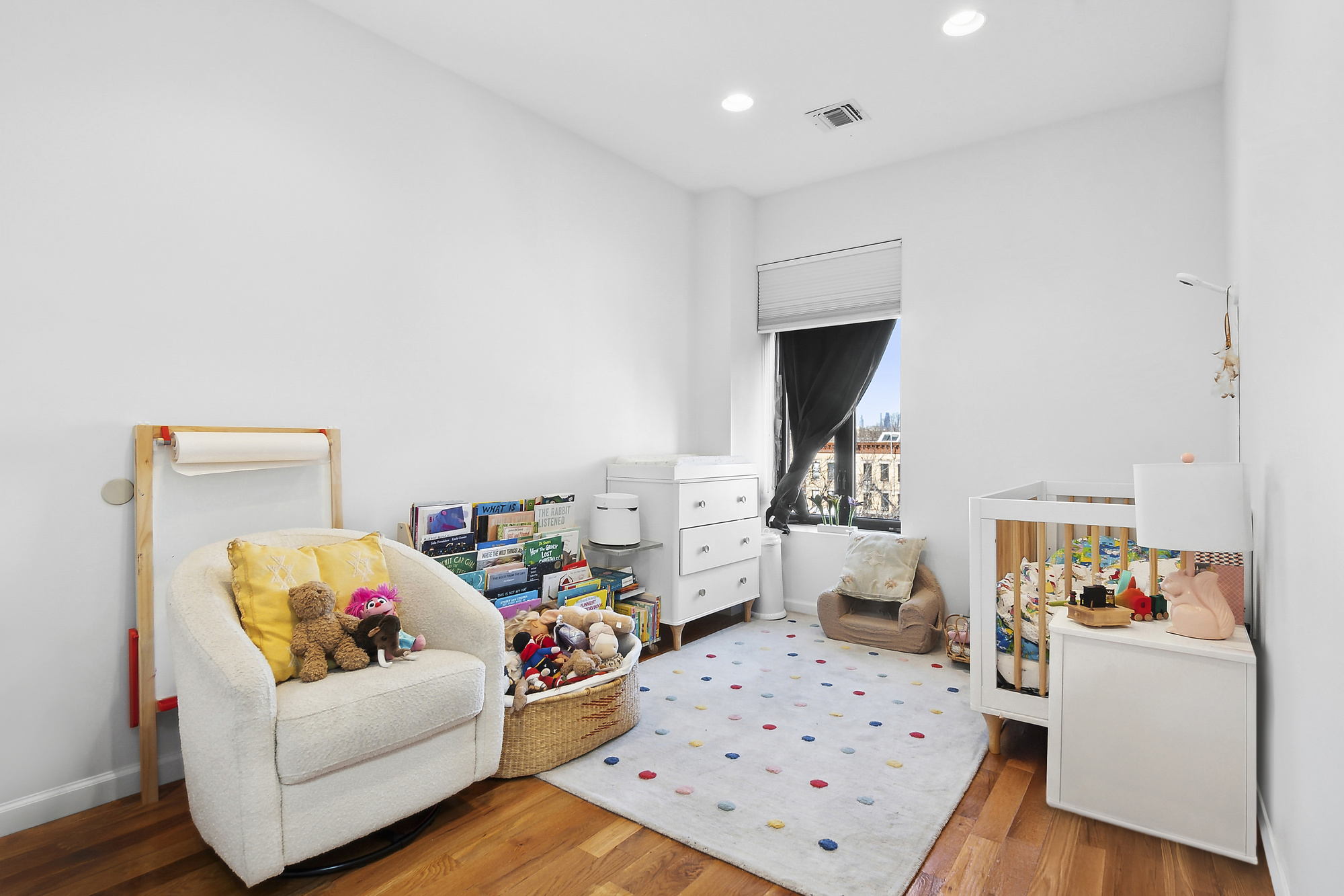 147 Herkimer Street, Unit 2 Brooklyn, NY 11216 - Photo 5 of 9 a living room with furniture and a wooden floor