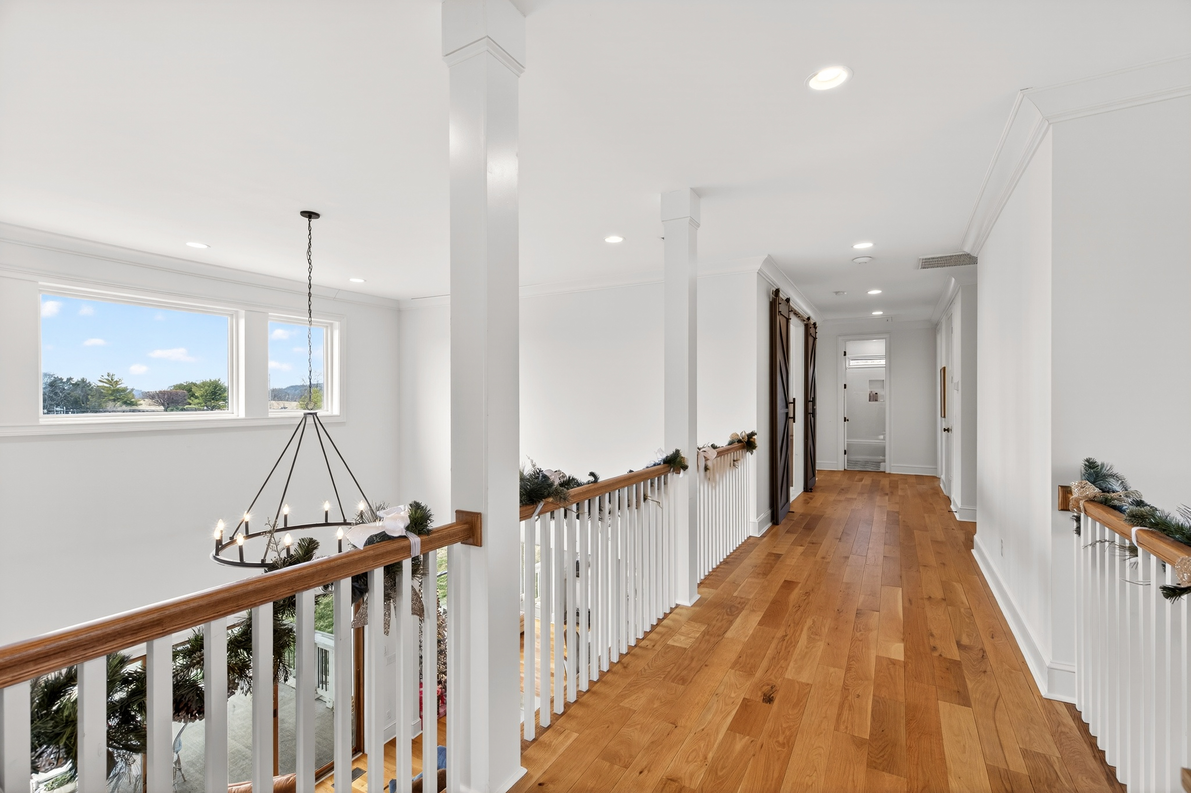 1703 Swansons Rdg Drive Franklin, TN 37064 - Photo 44 of 67 a view of a hallway with wooden floor and stairs