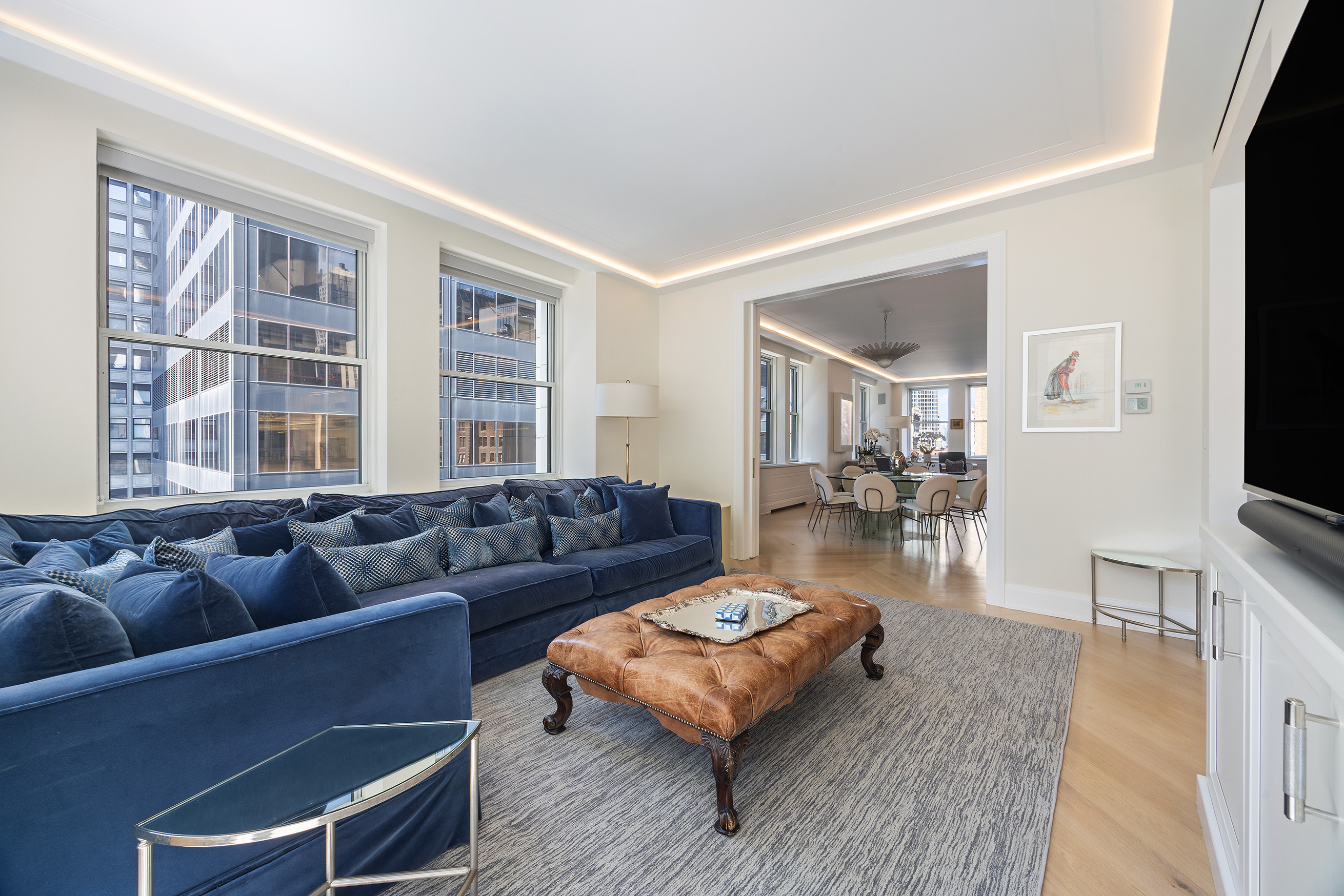 55 Liberty Street, Unit 15 Manhattan, NY 10005 - Photo 8 of 25 a living room with furniture and a flat screen tv