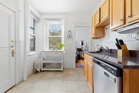 a kitchen with a stove and a sink