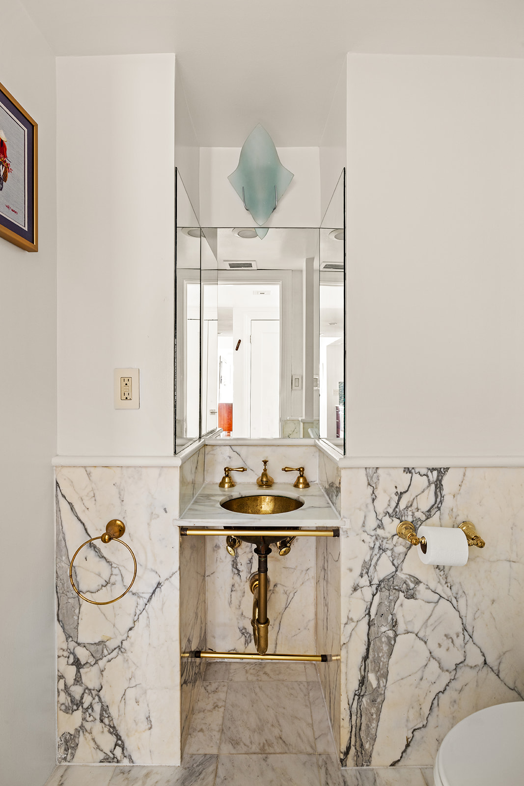 330 East 49th Street, Unit 12E Manhattan, NY 10017 - Photo 15 of 16 a bathroom with a sink and a mirror