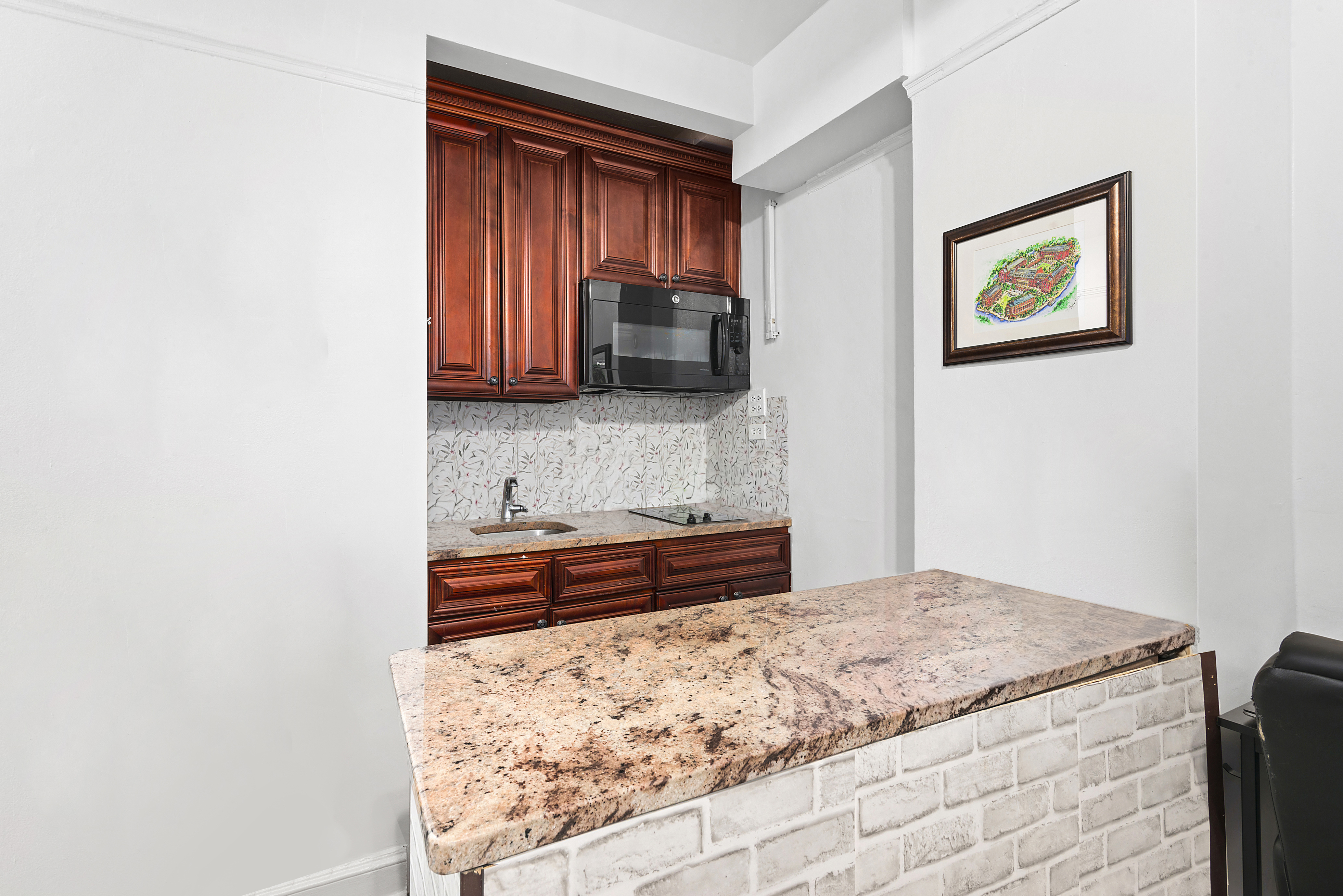 5 Tudor City Place, Unit 1518 Manhattan, NY 10017 - Photo 2 of 9 a bedroom with a bed and a dresser in it