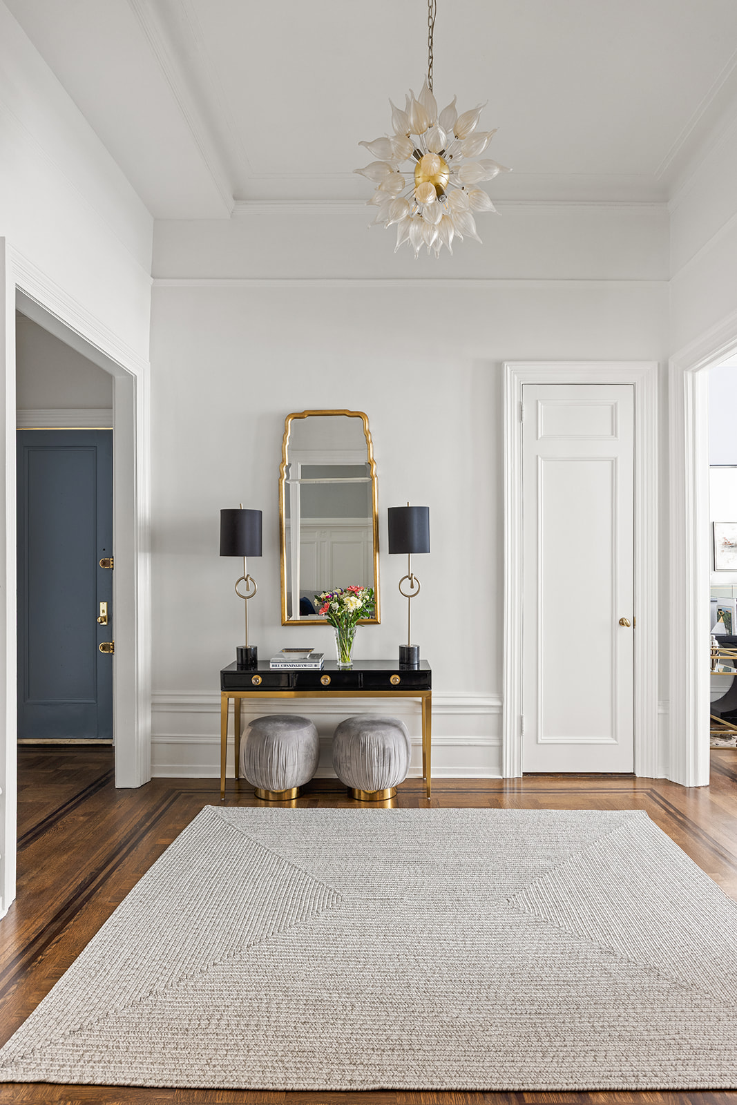 895 West End Avenue, Unit 1B Manhattan, NY 10025 - Photo 4 of 23 a living room with furniture a chandelier and a rug