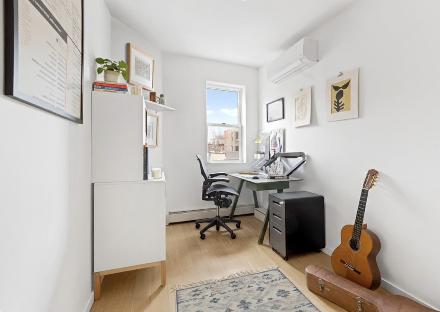 272 Putnam Avenue, Unit B Brooklyn, NY 11216 - Photo 8 of 13 a view of a workspace with furniture and a window