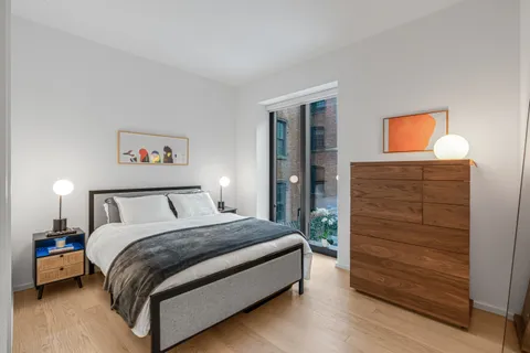 a bedroom with a bed and a closet