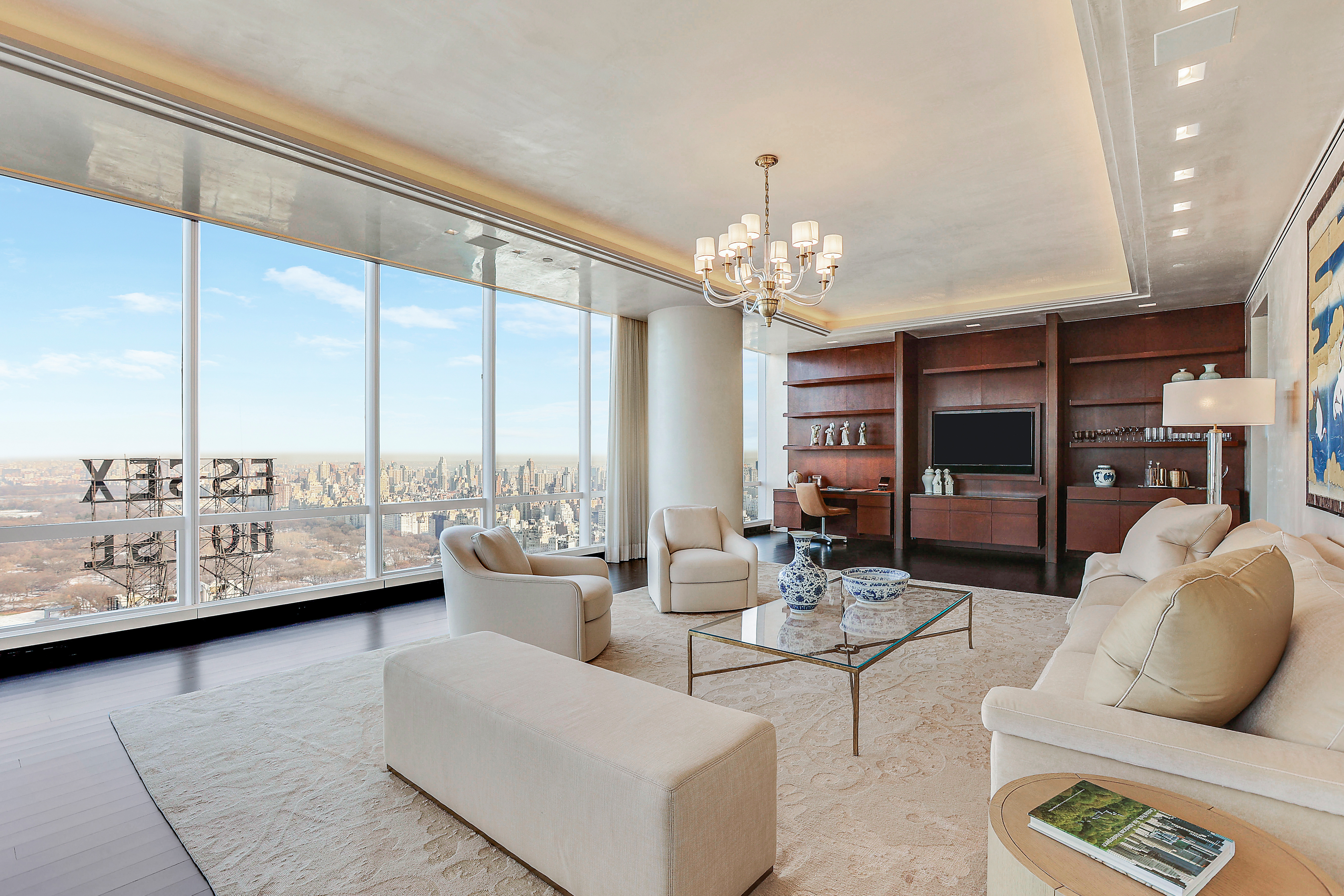 157 West 57th Street, Unit 51A Manhattan, NY 10019 - Photo 2 of 15 a living room with furniture and a large window