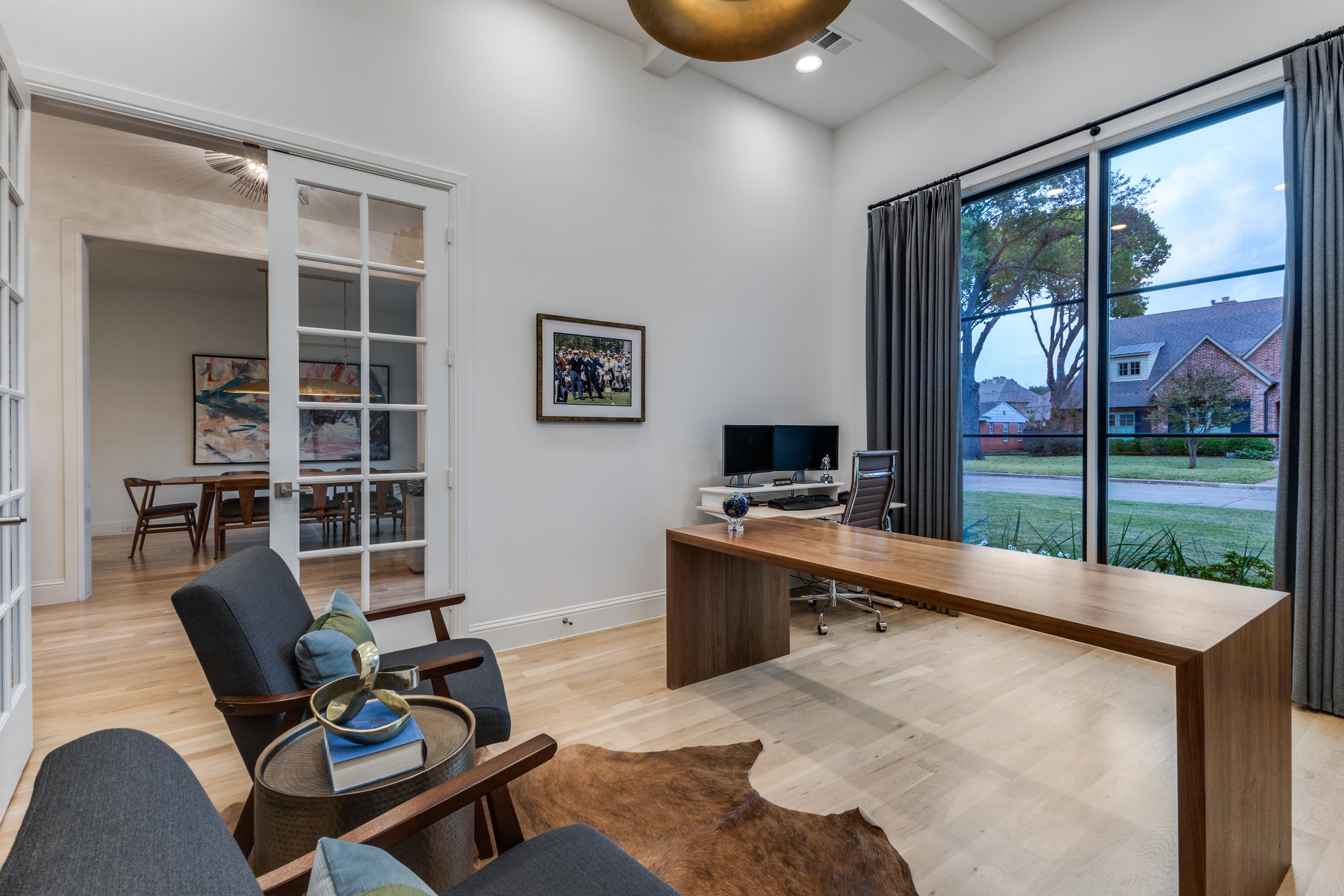 4042 Dunhaven Road Dallas, TX 75220 - Photo 5 of 34 a view of a workspace with furniture and a window