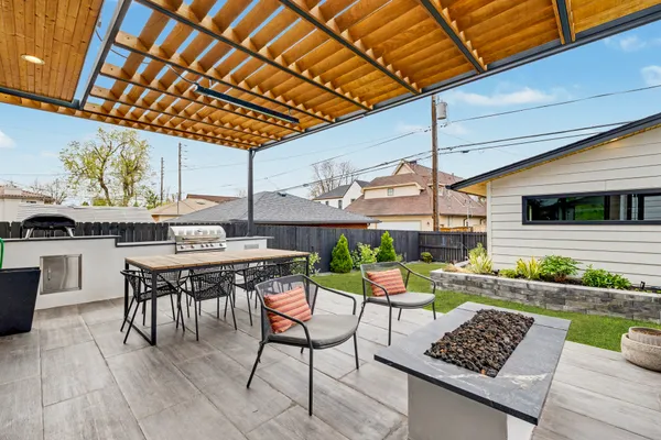 a outdoor space with lots of tables a chair and painted walls