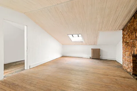 a view of a hallway with staircase