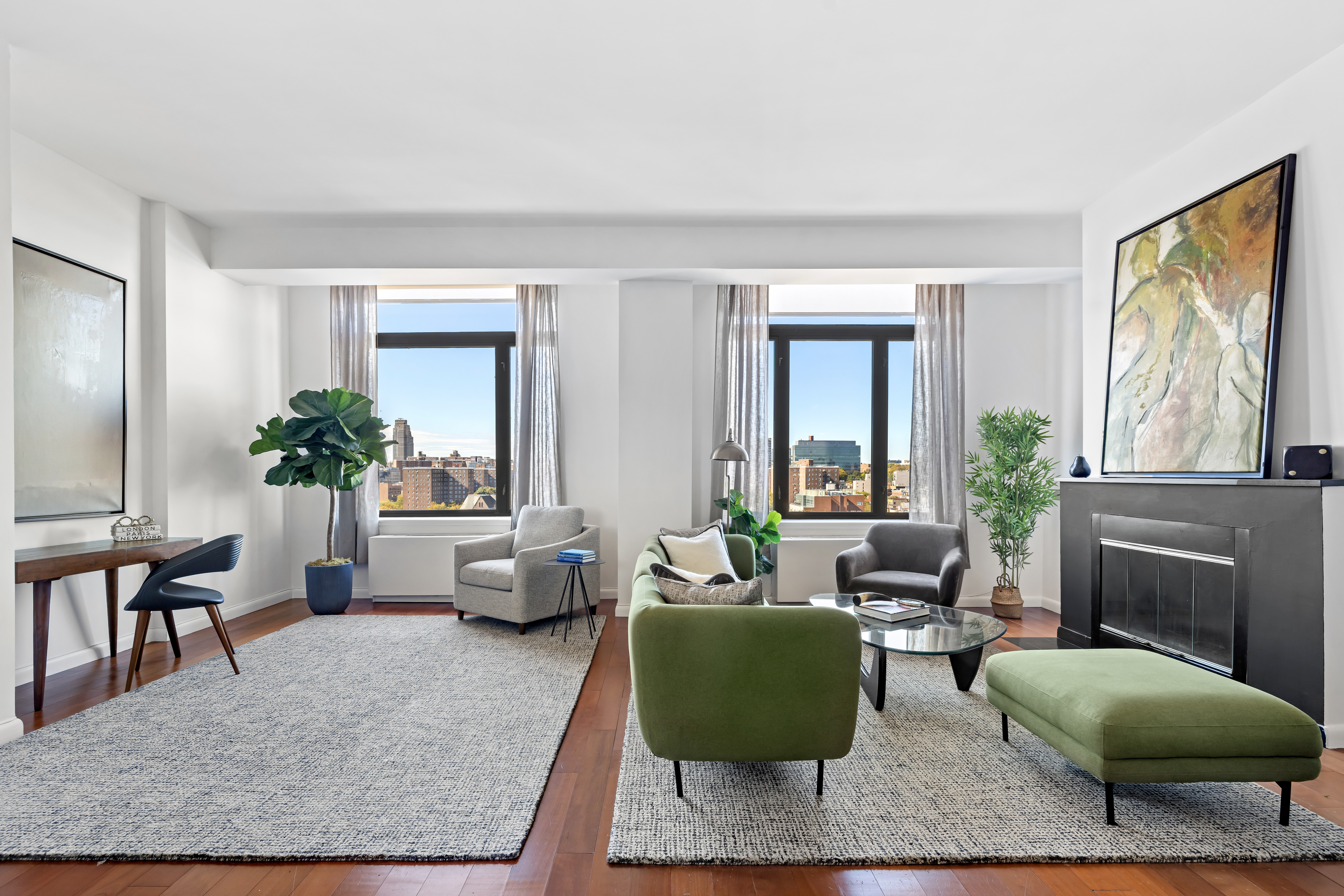 380 Lenox Avenue, Unit PHE Manhattan, NY 10027 - Photo 1 of 15 a living room with furniture and a potted plant