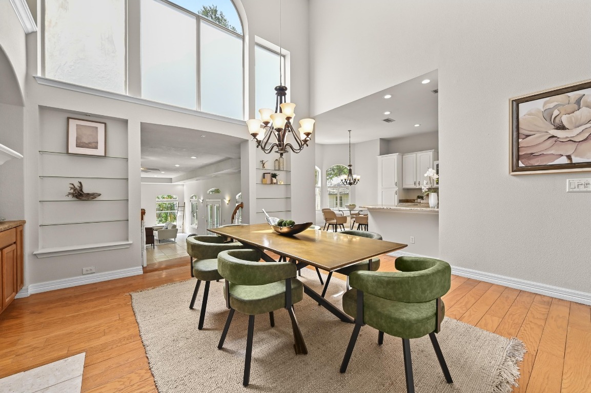 111 Trinity Street Cedar Creek, TX 78612 - Photo 13 of 38 a view of a dining room with furniture and wooden floor
