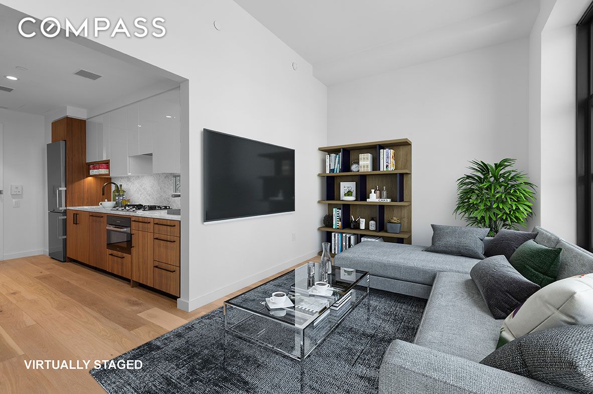 29 Huron Street, Unit 10AW Brooklyn, NY 11222 - Photo 4 of 13 a living room with furniture and a flat screen tv