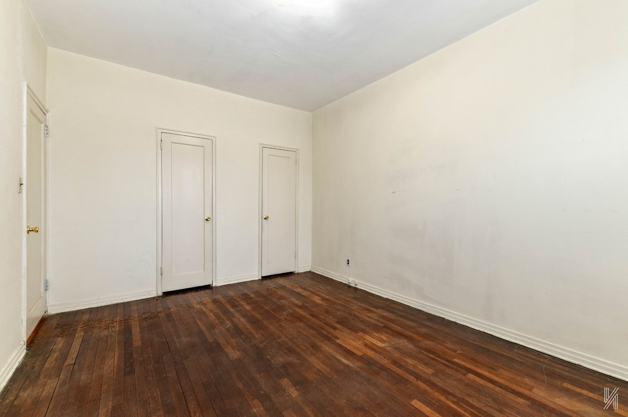 22-60 79th Street, Unit 1A Queens, NY 11370 - Photo 10 of 17 a view of room with wooden floor