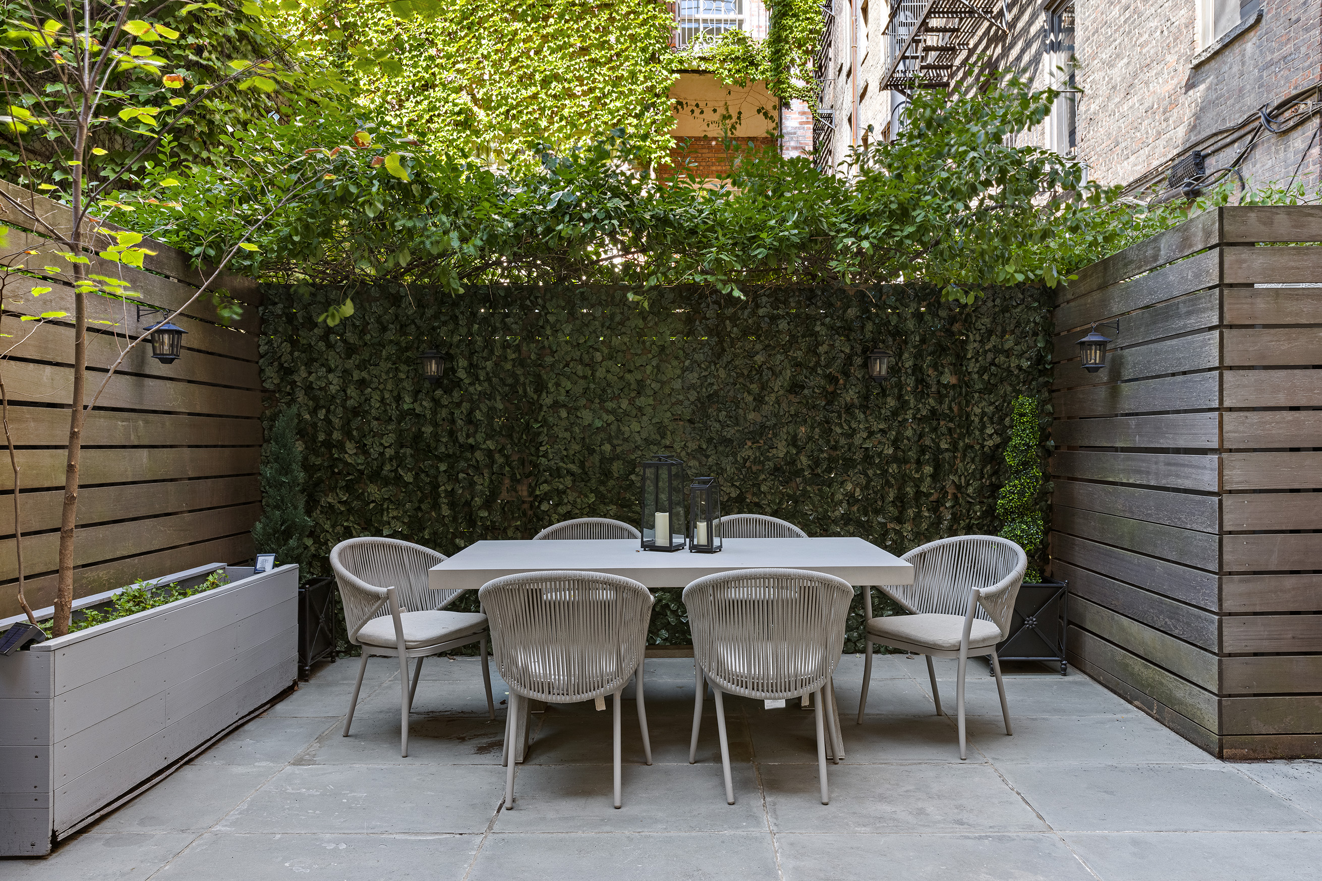 25 East 94th Street Manhattan, NY 10128 - Photo 29 of 33 a view of a patio with a table and chairs