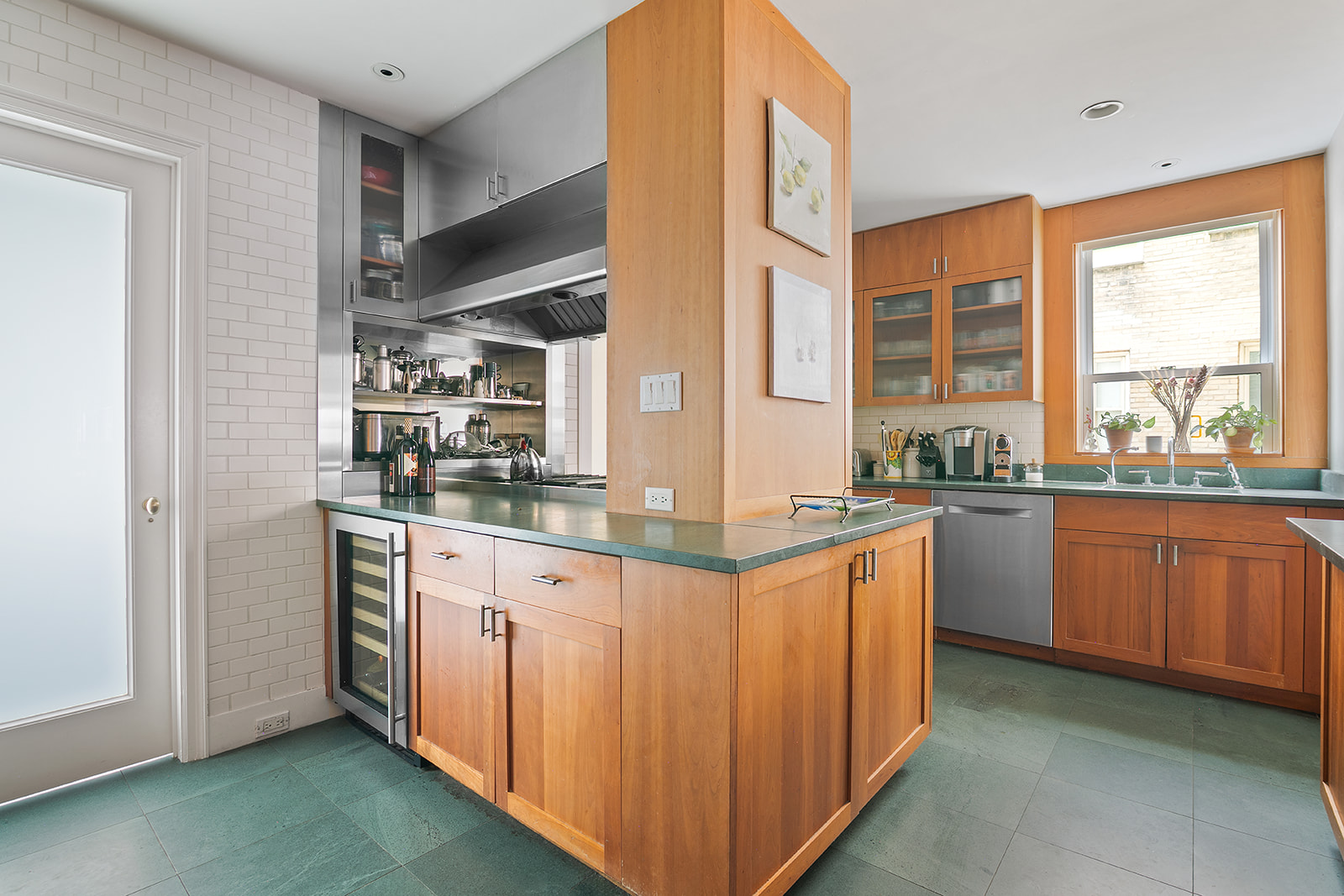 15 West 81st Street, Unit 10B Manhattan, NY 10024 - Photo 4 of 19 a kitchen with stainless steel appliances granite countertop a stove a sink and a refrigerator