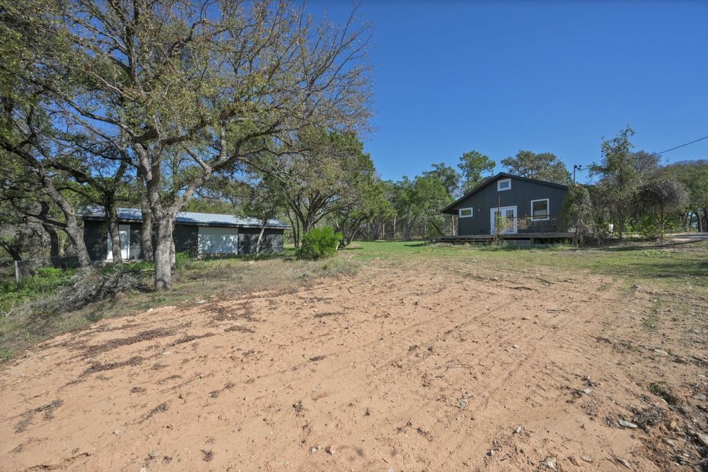 4416 Stearn's Lane Austin, TX 78735 - Photo 32 of 32 a view of a house with a yard