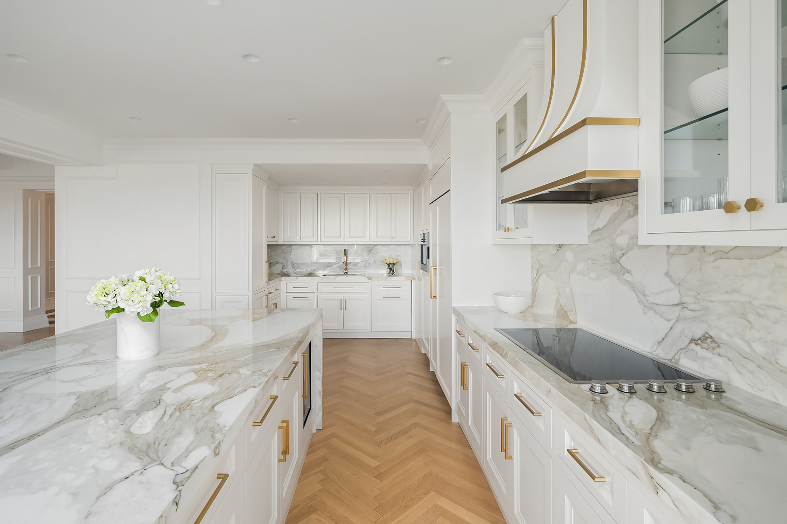 930 5th Avenue, Unit 18A Manhattan, NY 10021 - Photo 5 of 16 a large white kitchen with granite countertop a sink