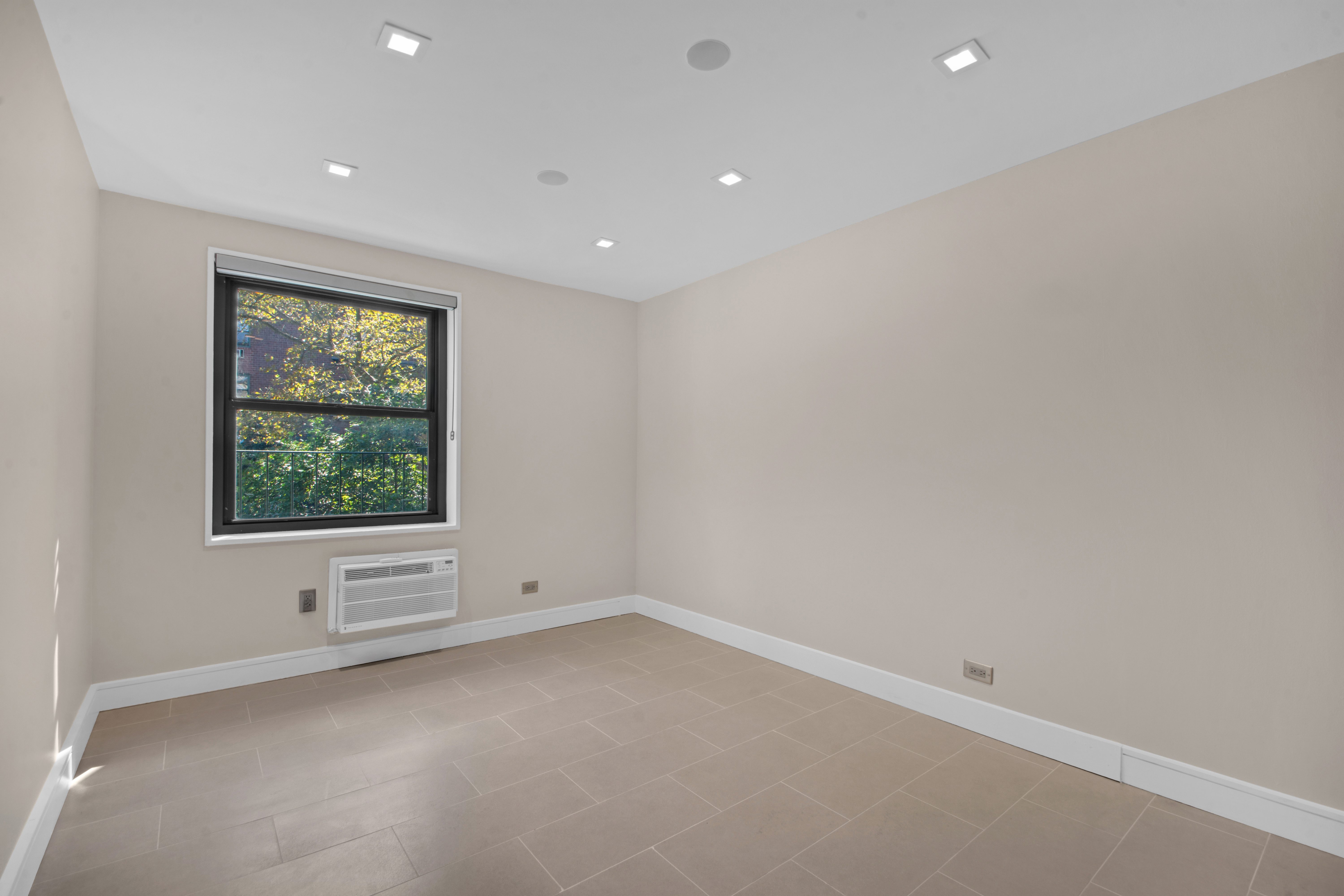 690 Washington Street, Unit 1A Manhattan, NY 10014 - Photo 12 of 17 an empty room with a window