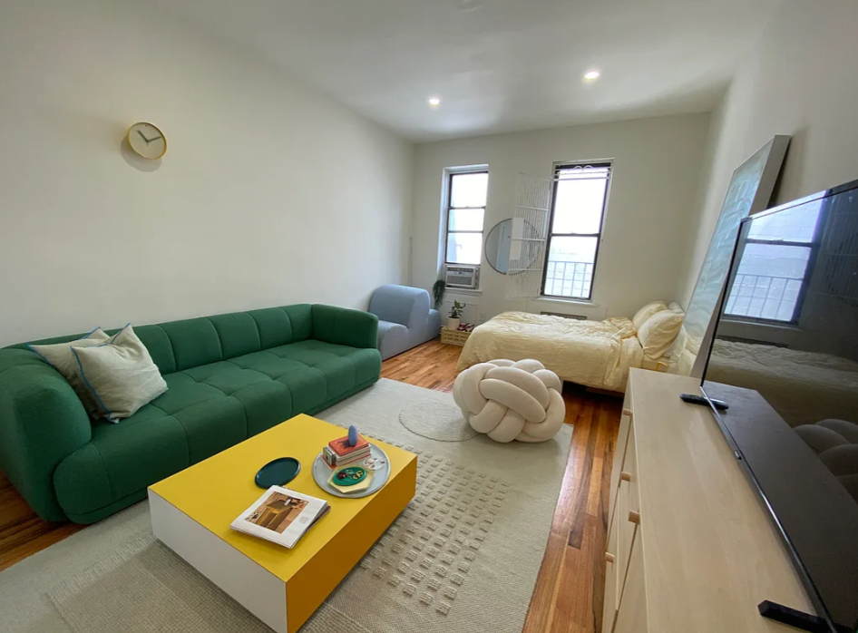 1728 2nd Avenue, Unit 3C Manhattan, NY 10128 - Photo 1 of 4 a living room with furniture and a window