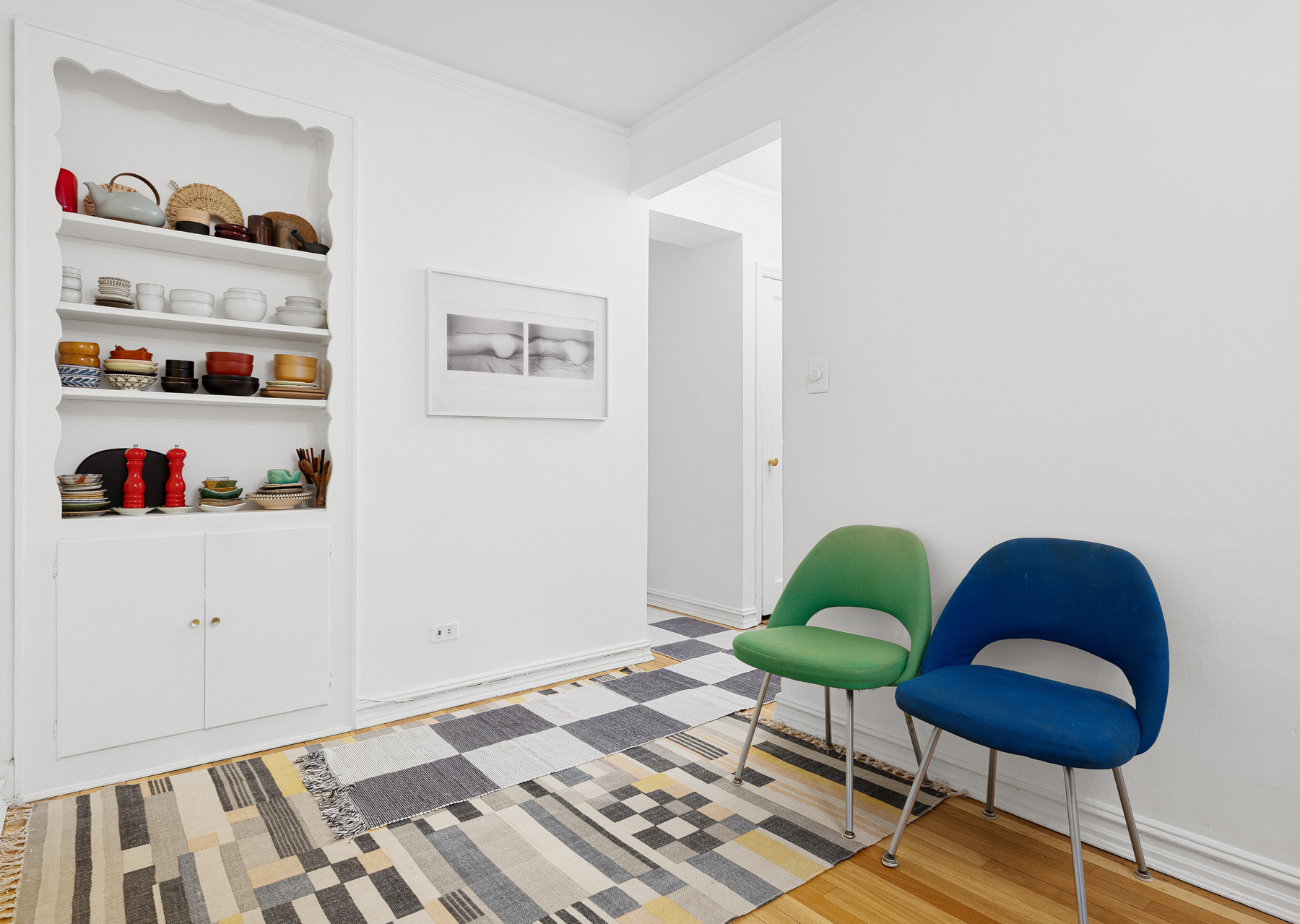 77-11 35th Avenue, Unit 3N Queens, NY 11372 - Photo 10 of 21 a living room with furniture and a rug