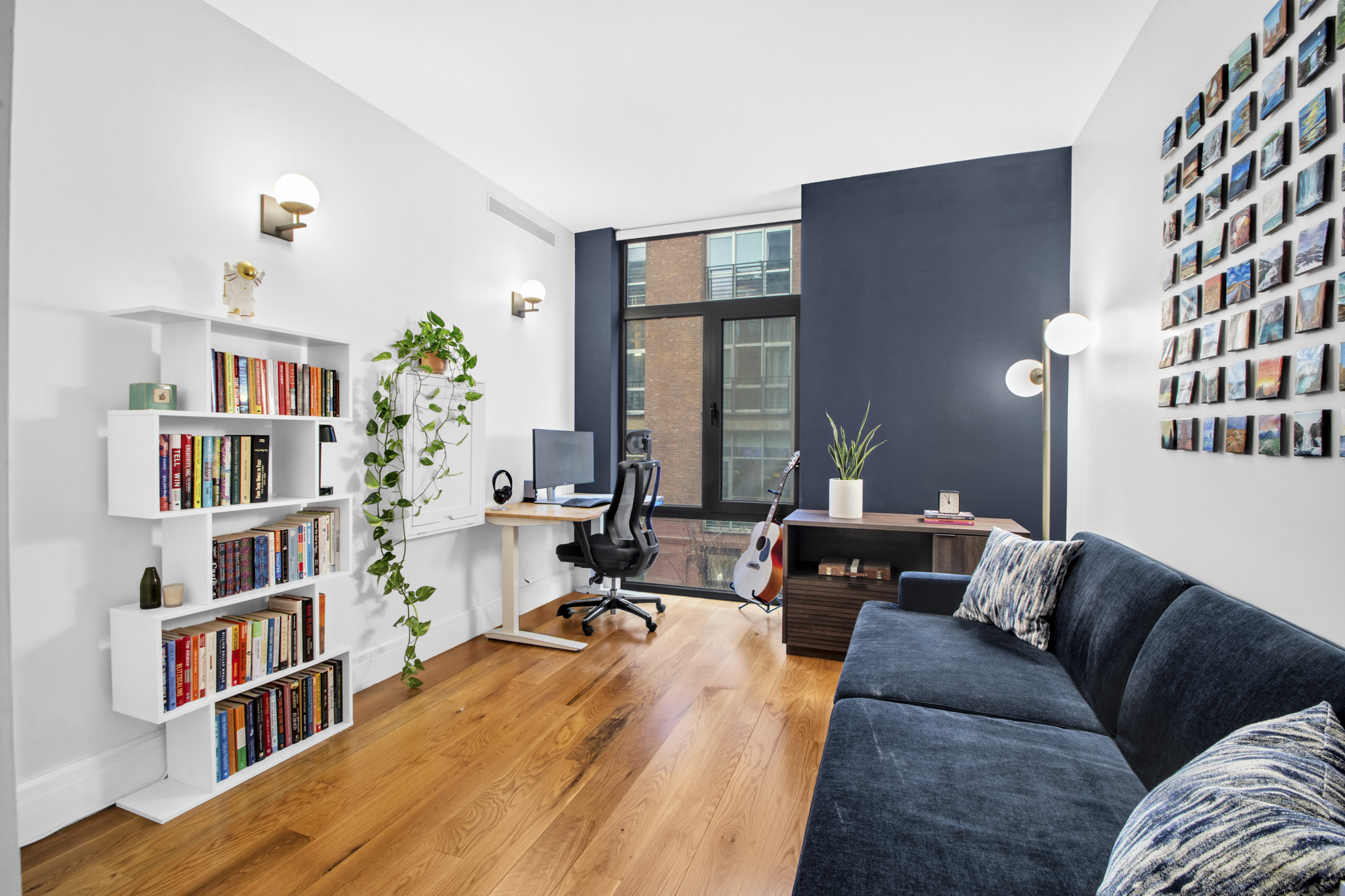 47 Bridge Street, Unit 3D Brooklyn, NY 11201 - Photo 12 of 27 a living room with furniture and a book shelf