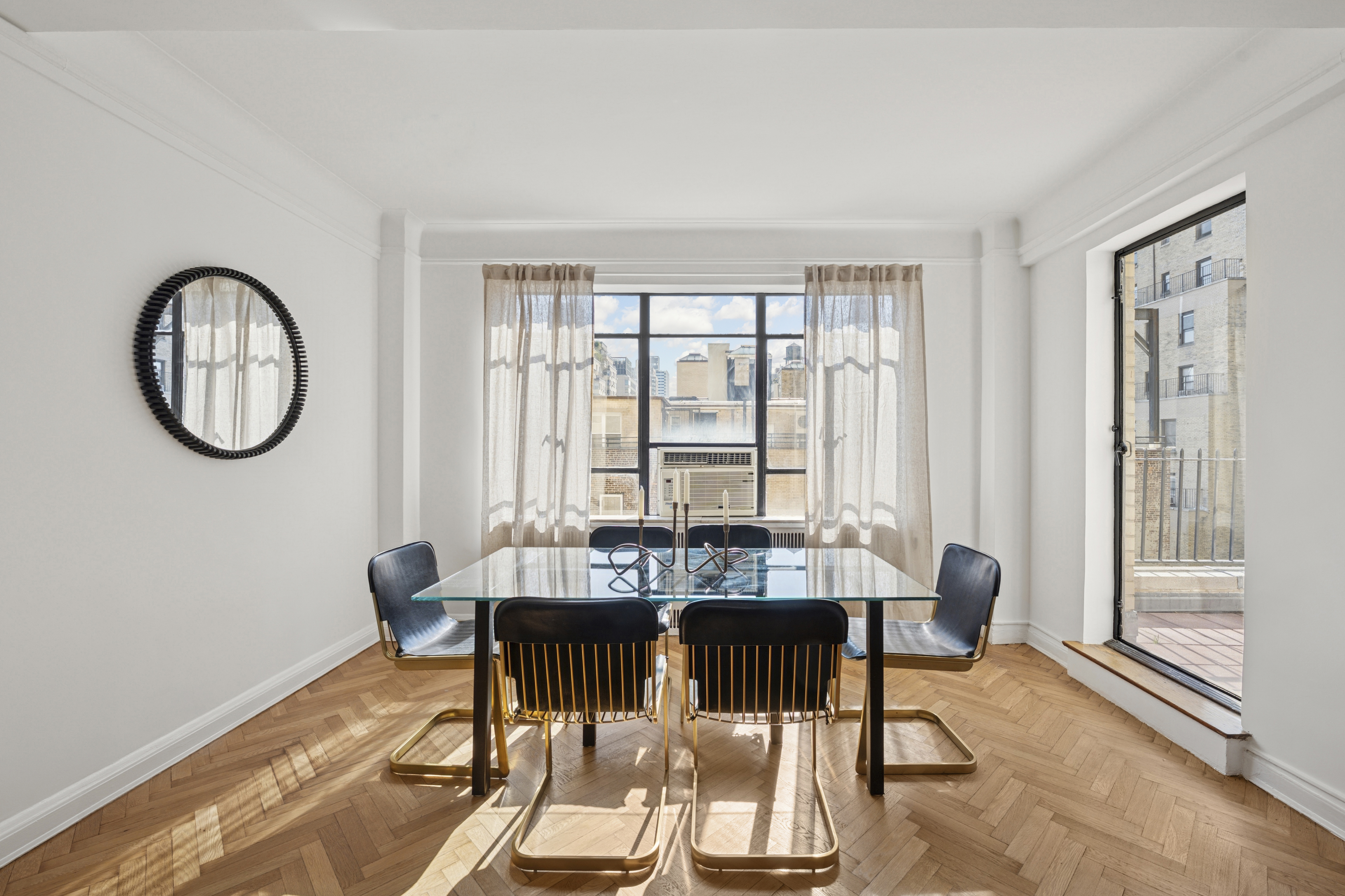 140 Riverside Drive, Unit 10N Manhattan, NY 10024 - Photo 4 of 21 a view of a dining room with furniture window and wooden floor