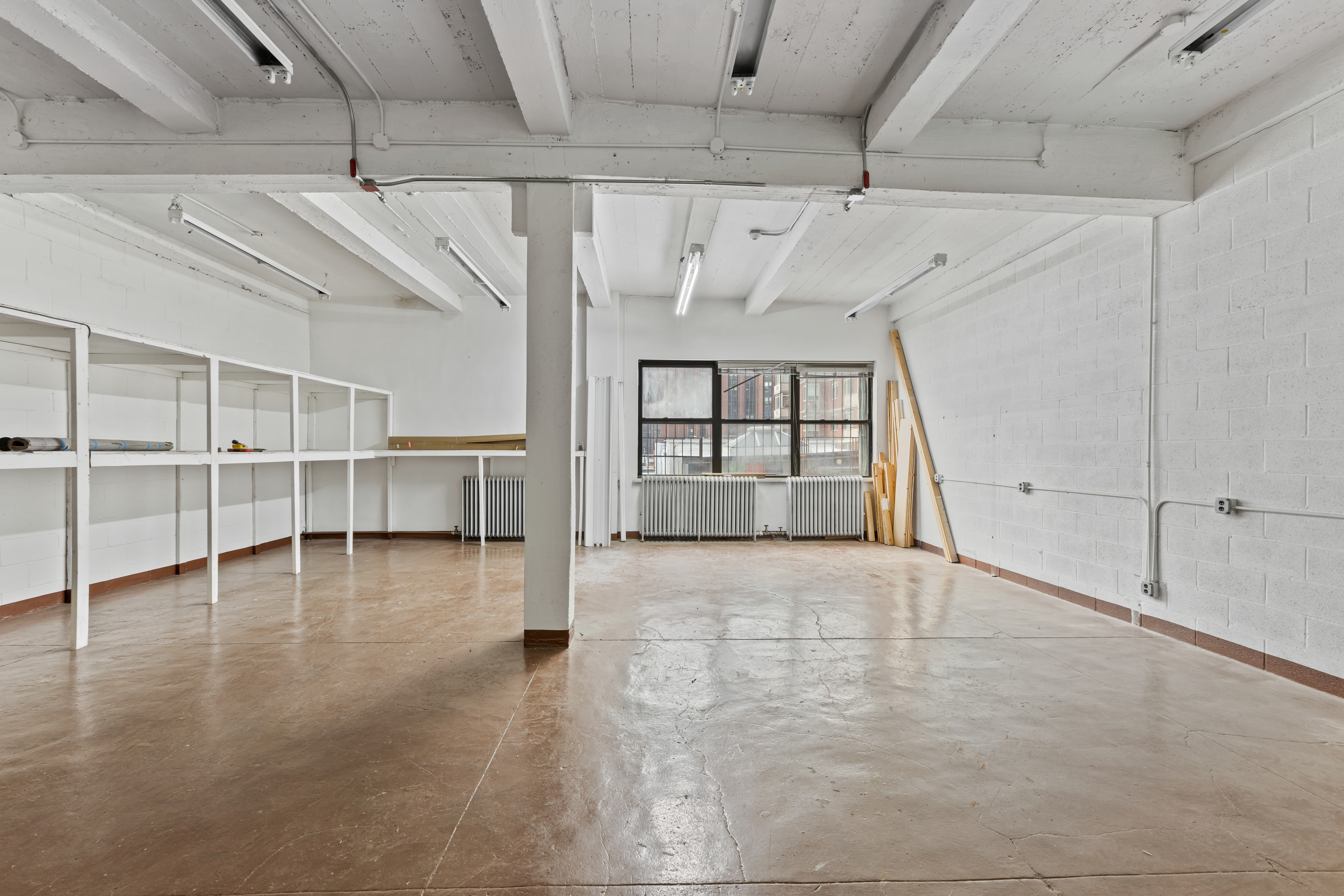 315 East 91st Street, Unit 6C Manhattan, NY 10128 - Photo 5 of 8 a view of an empty room with a window