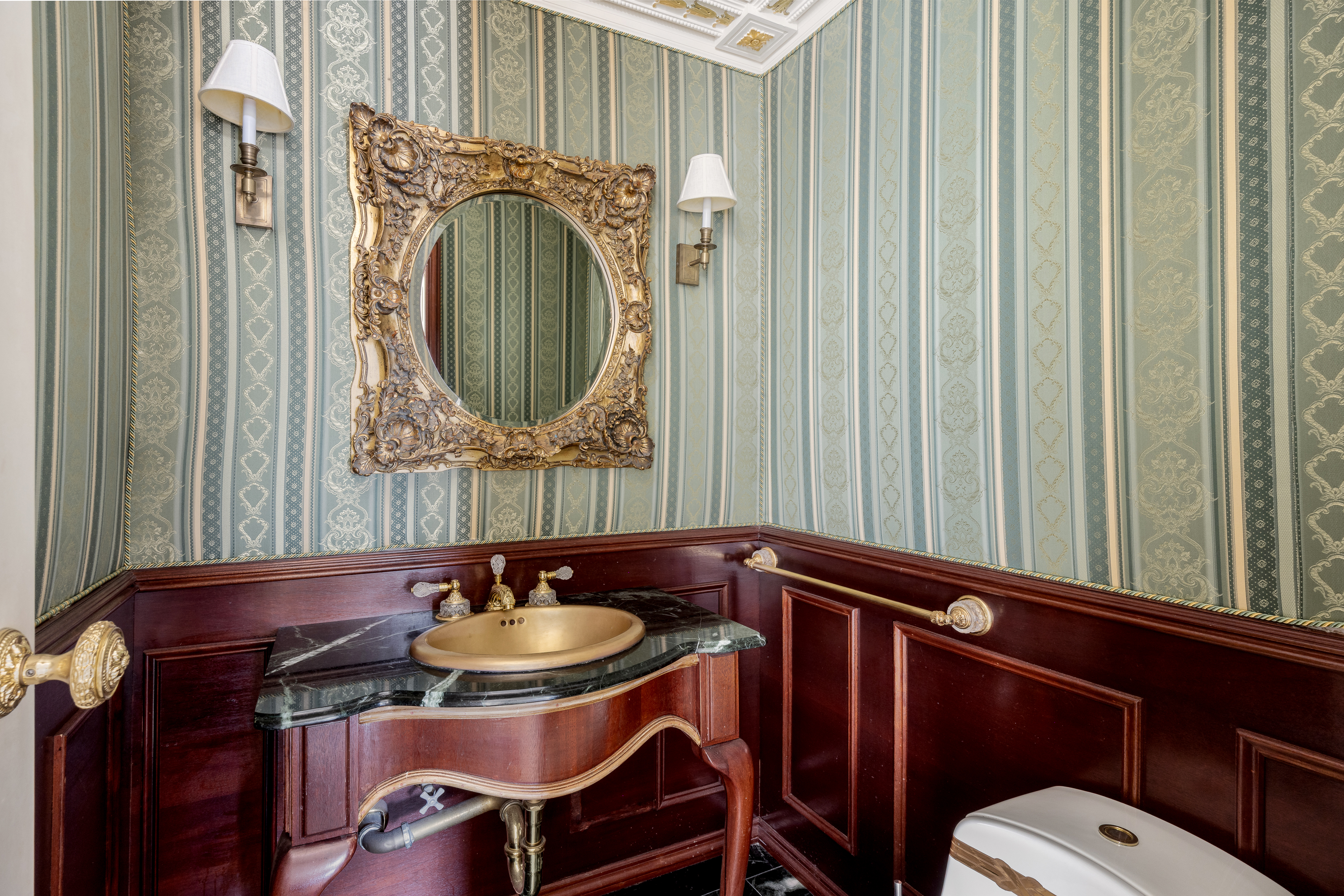 641 5th Avenue, Unit 27A Manhattan, NY 10022 - Photo 24 of 29 a bathroom with a sink a mirror and a toilet
