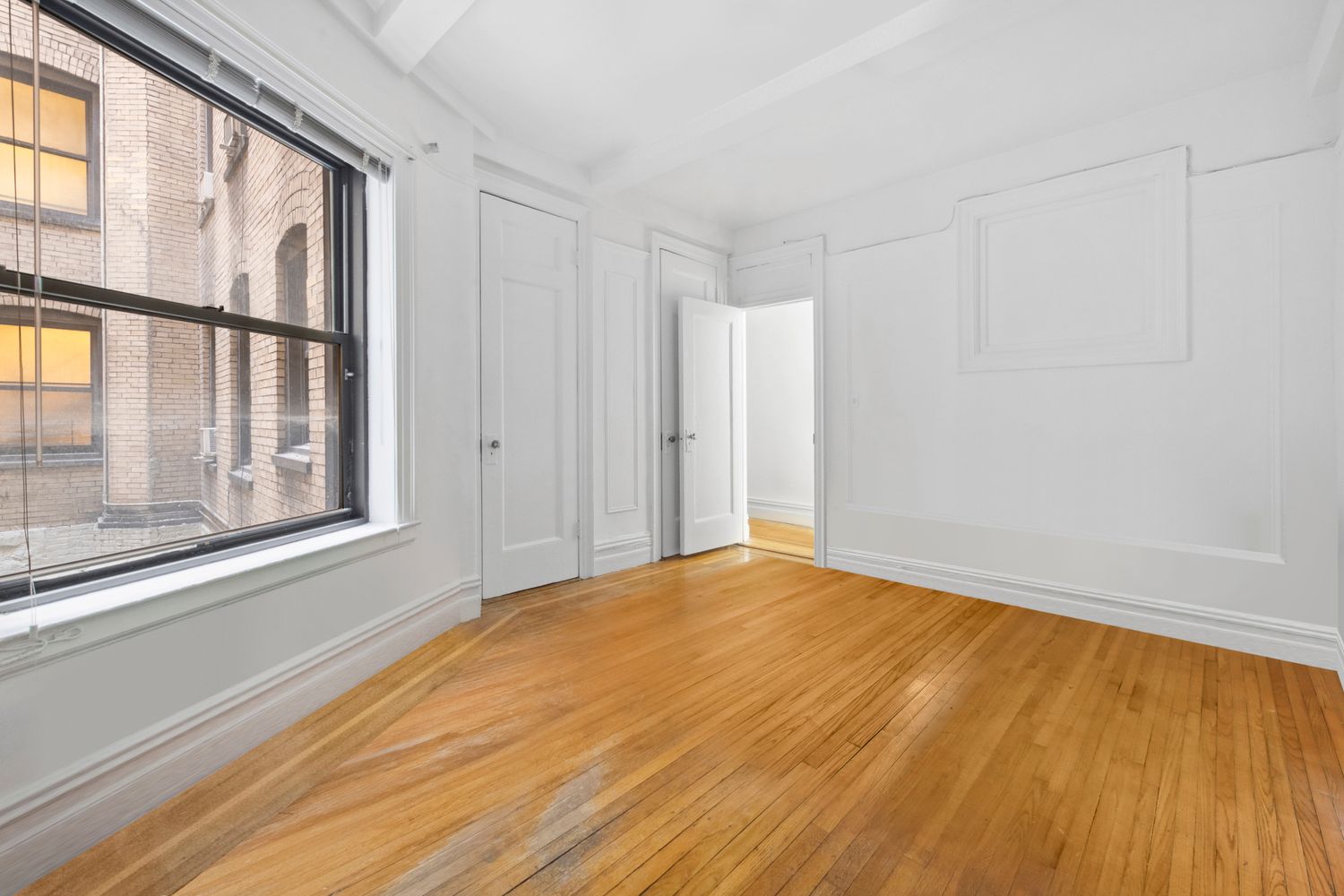a view of an empty room with a window