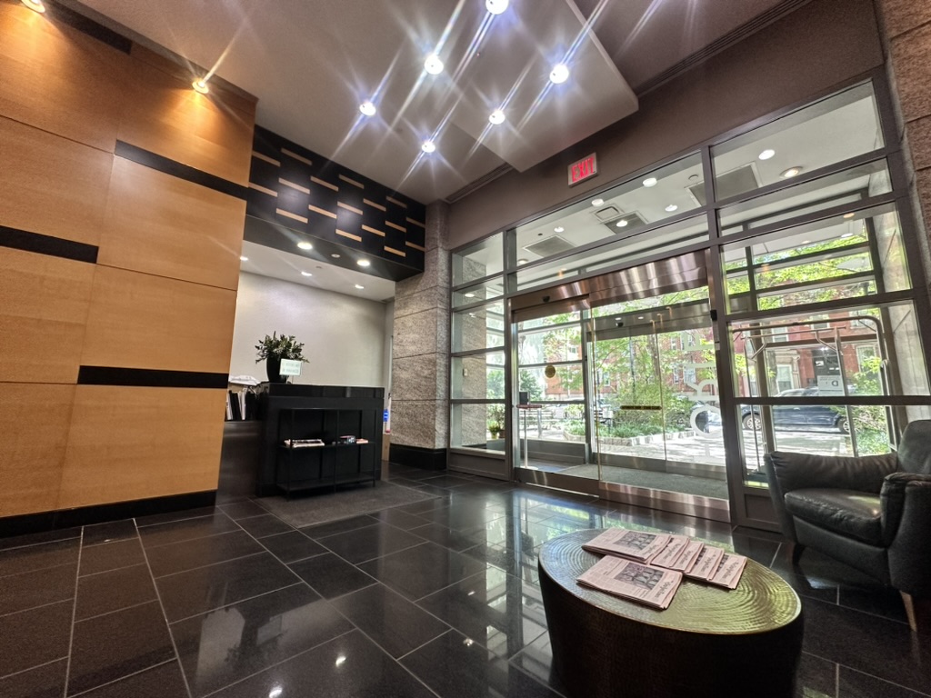 230 Ashland Place, Unit 19D Brooklyn, NY 11217 - Photo 10 of 11 a living room with a couch and a table