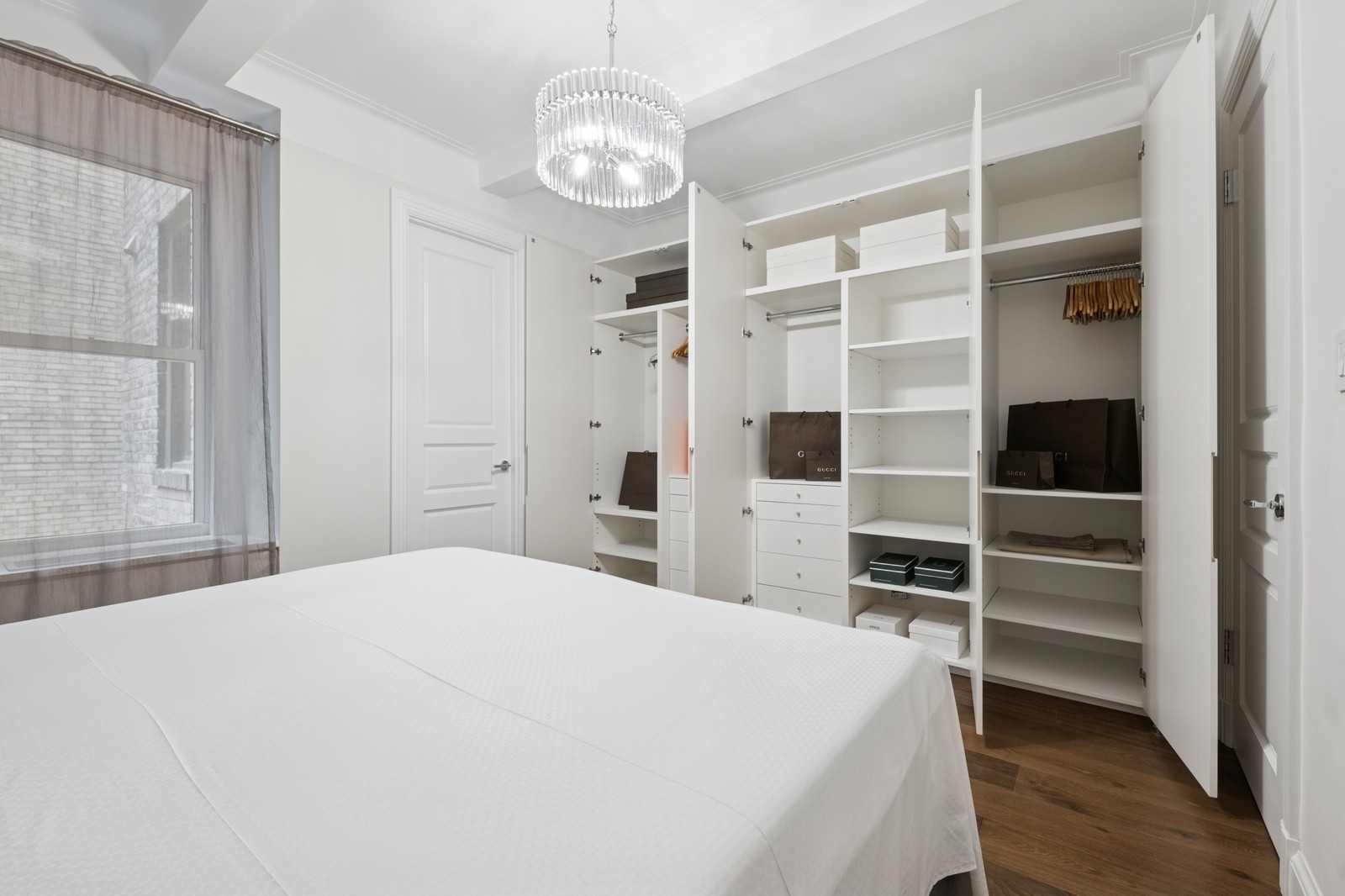 108 East 91st Street, Unit 4B Manhattan, NY 10128 - Photo 7 of 11 a spacious bedroom with a bed and a view of walk in closet