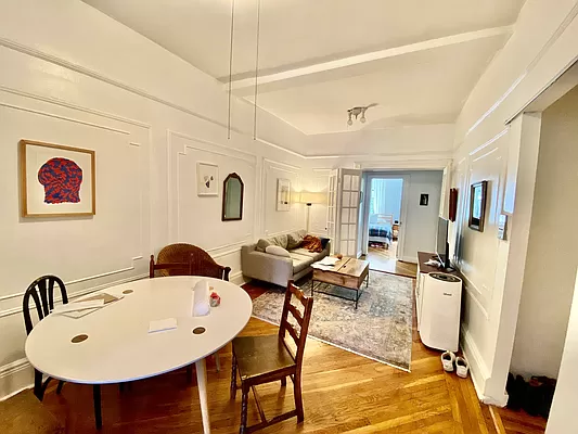 351 7th Avenue, Unit 2 Brooklyn, NY 11215 - Photo 5 of 10 a living room with furniture a rug and white walls