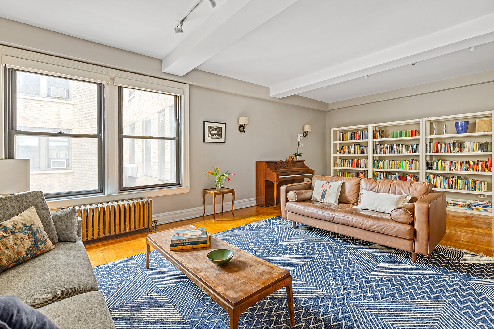 135 Eastern Parkway, Unit 13E Brooklyn, NY 11238 - Photo 5 of 15 a living room with furniture and a window