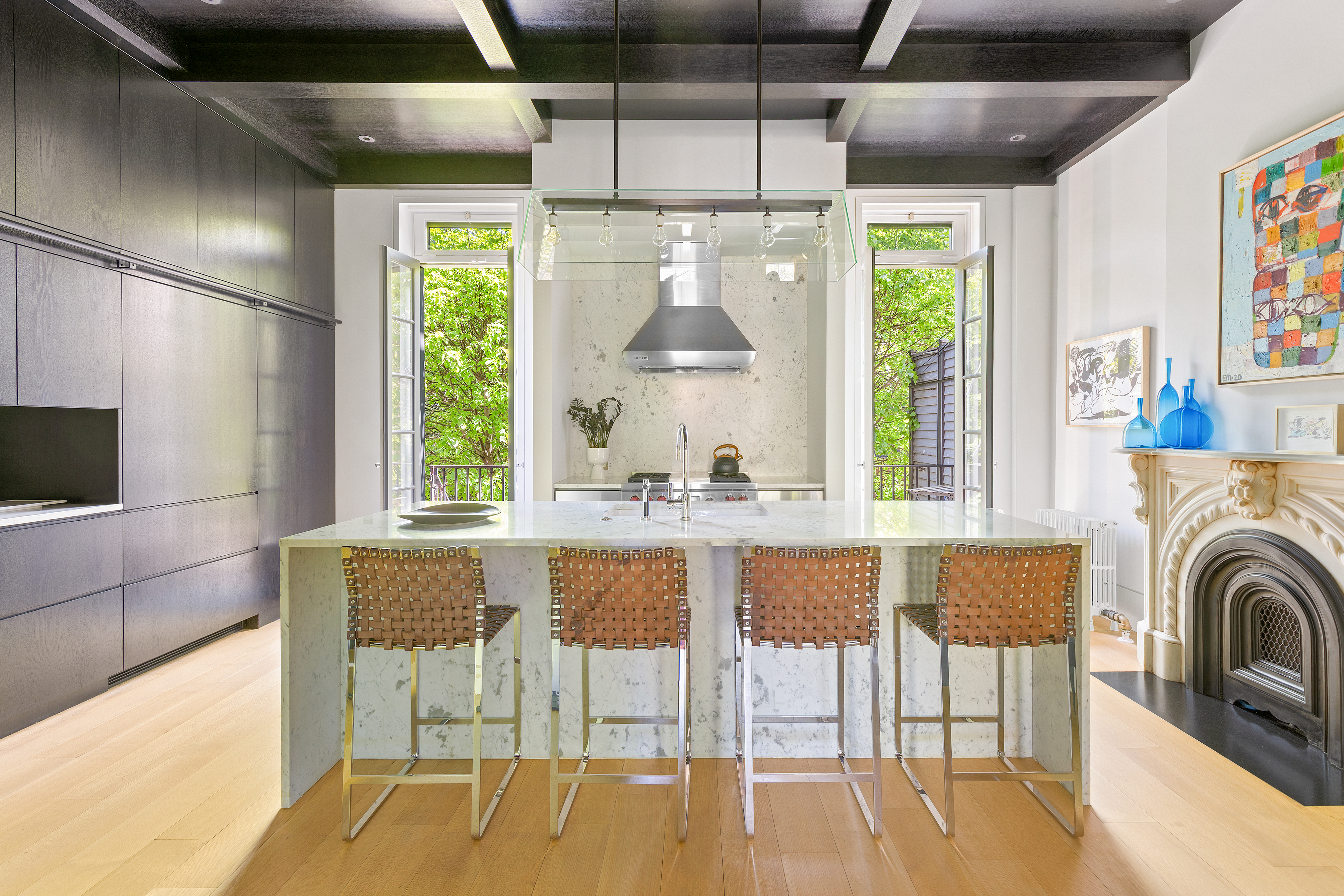 315 Adelphi Street Brooklyn, NY 11205 - Photo 6 of 31 a dining room with stainless steel appliances granite countertop a table chairs and a large window