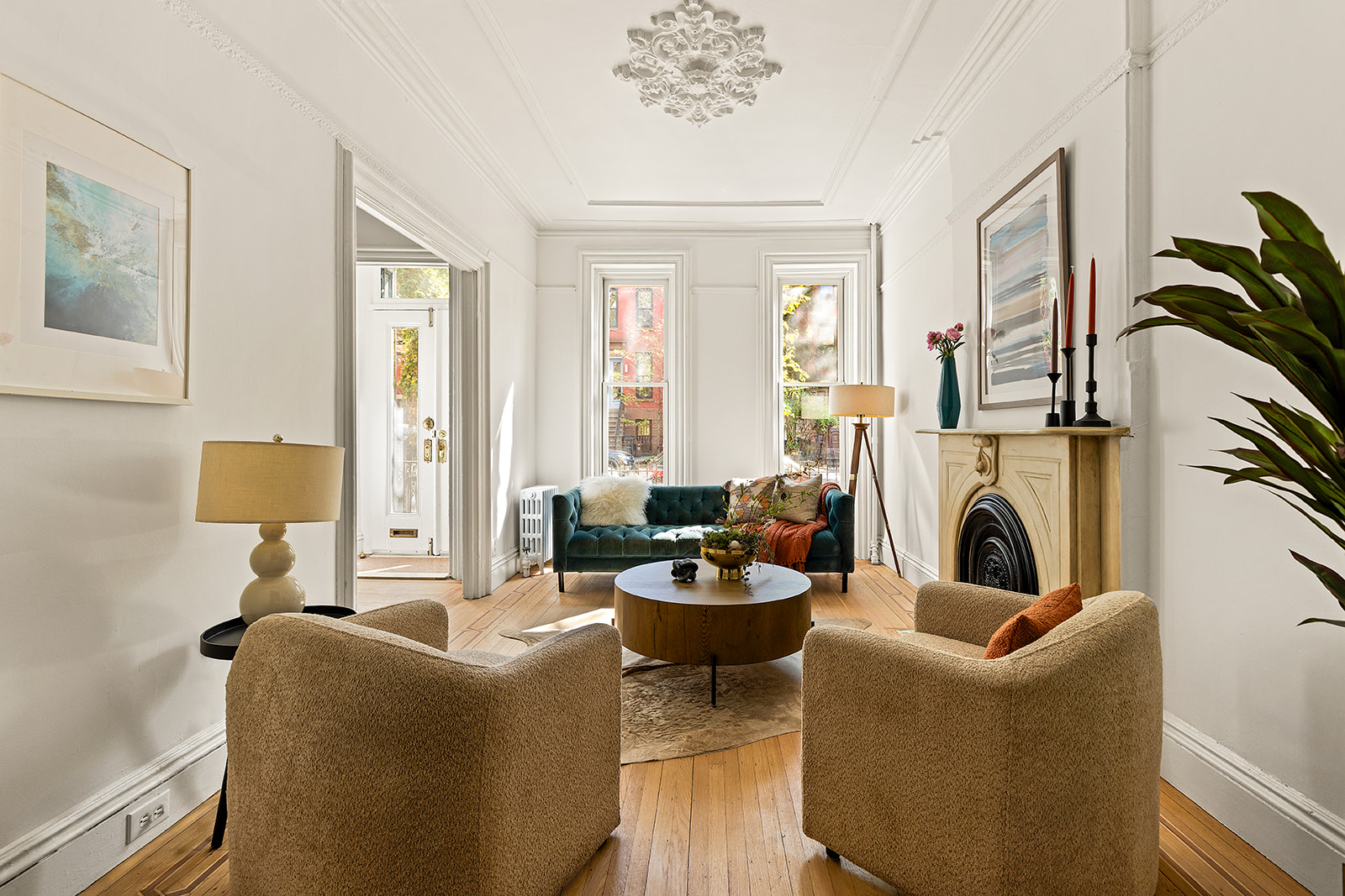 467 11th Street Brooklyn, NY 11215 - Photo 2 of 14 a living room with furniture a fireplace and a potted plants next to a window