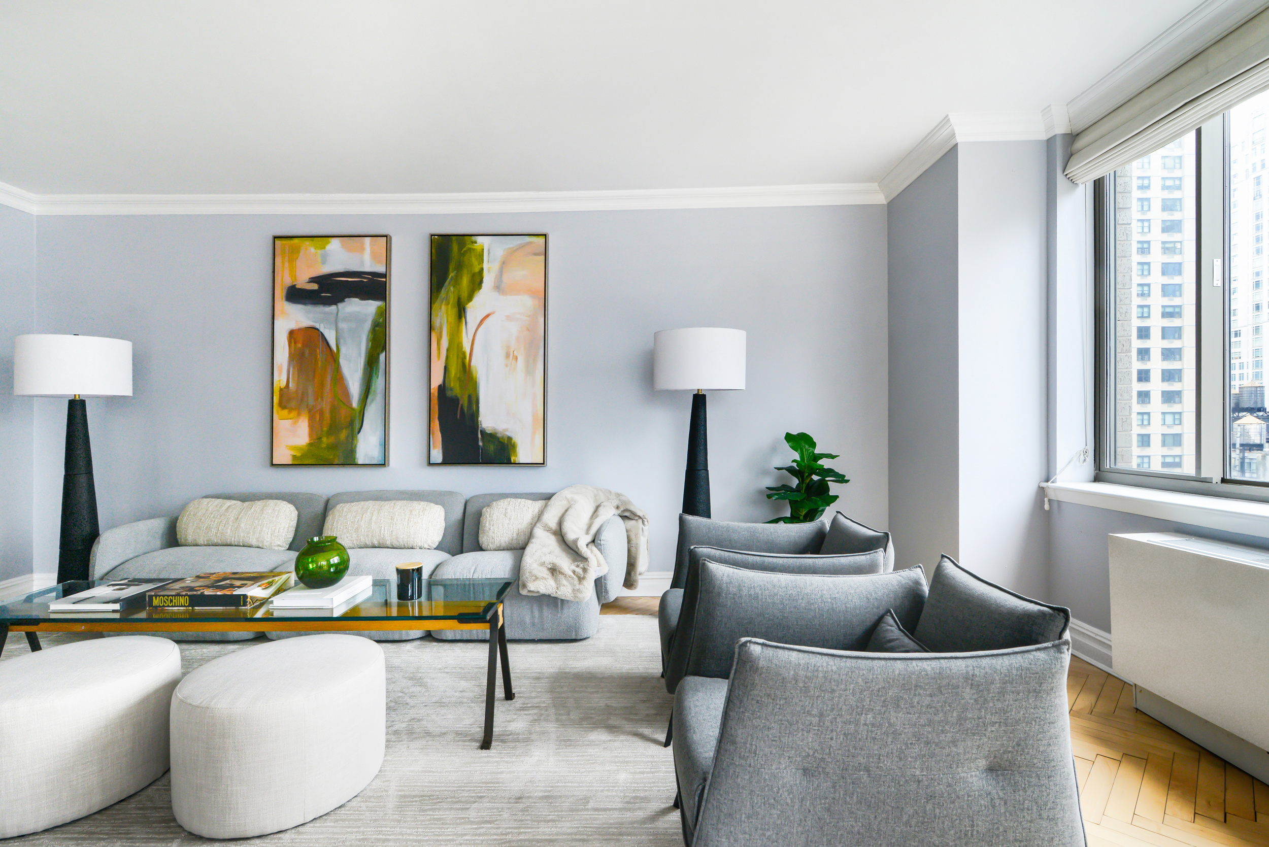 2 Columbus Avenue, Unit 17C Manhattan, NY 10023 - Photo 4 of 19 a living room with furniture and a lamp