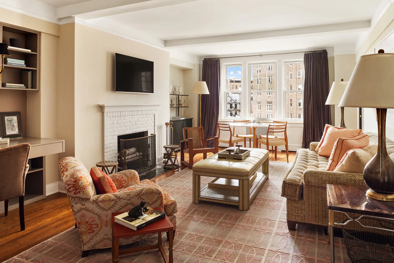 a living room with furniture fireplace and a flat screen tv