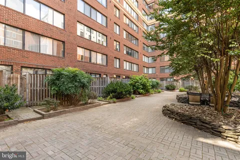 a front view of a building with garden