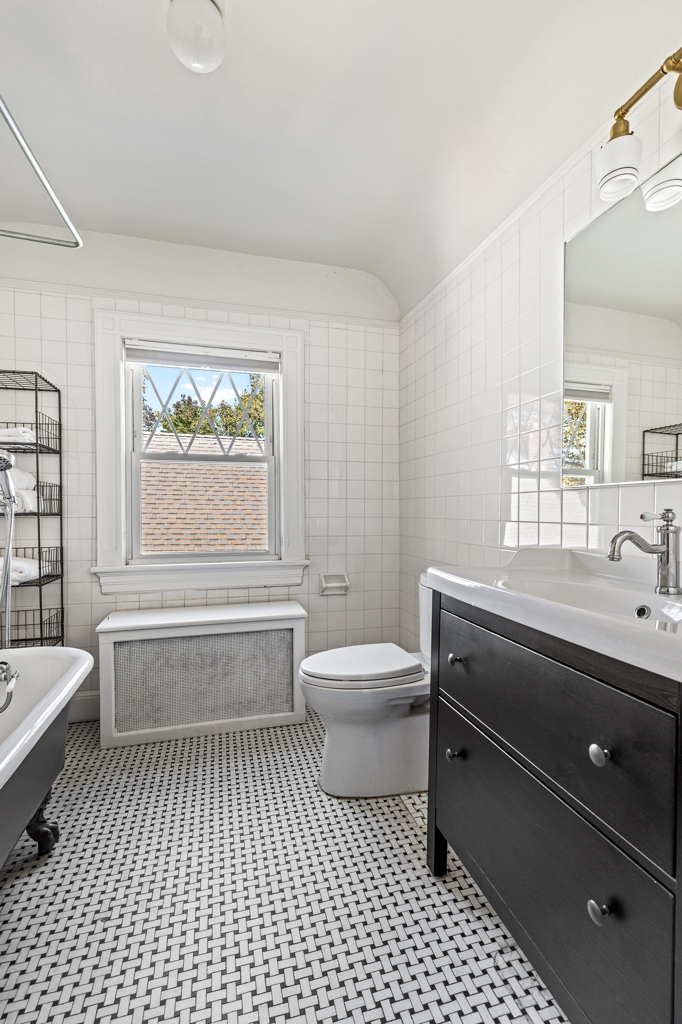 689 East 17th Street Brooklyn, NY 11230 - Photo 24 of 28 a bathroom with a sink a toilet and bathtub