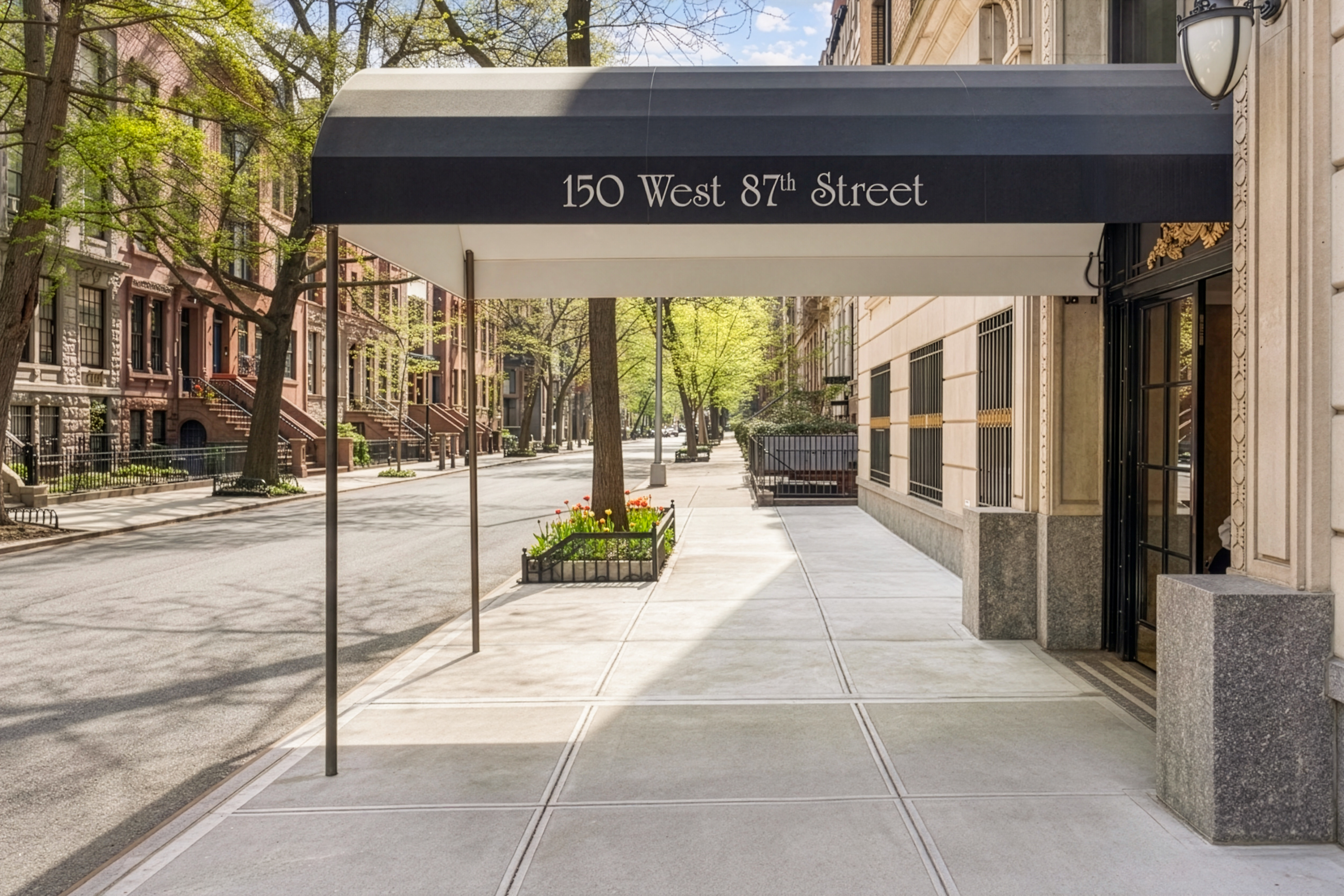 150 West 87th Street, Unit 7C Manhattan, NY 10024 - Photo 16 of 18 a view of a street with stores