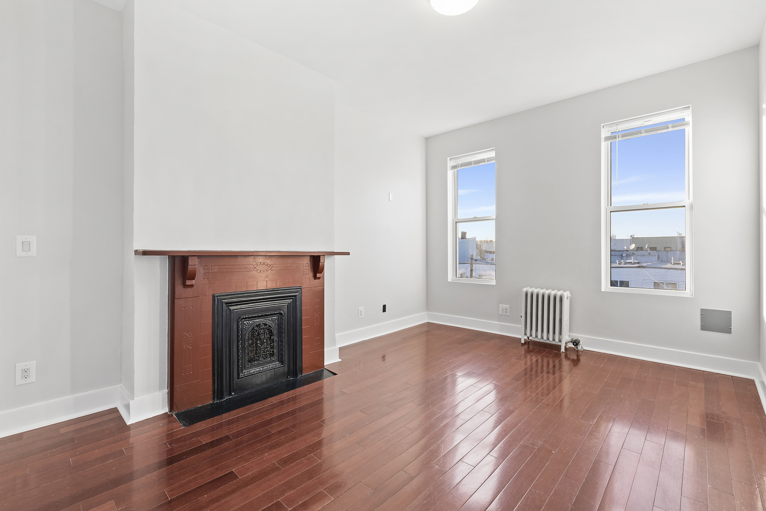 1275 Jefferson Avenue, Unit 3 Brooklyn, NY 11221 - Photo 4 of 6 an empty room with wooden floor and a window