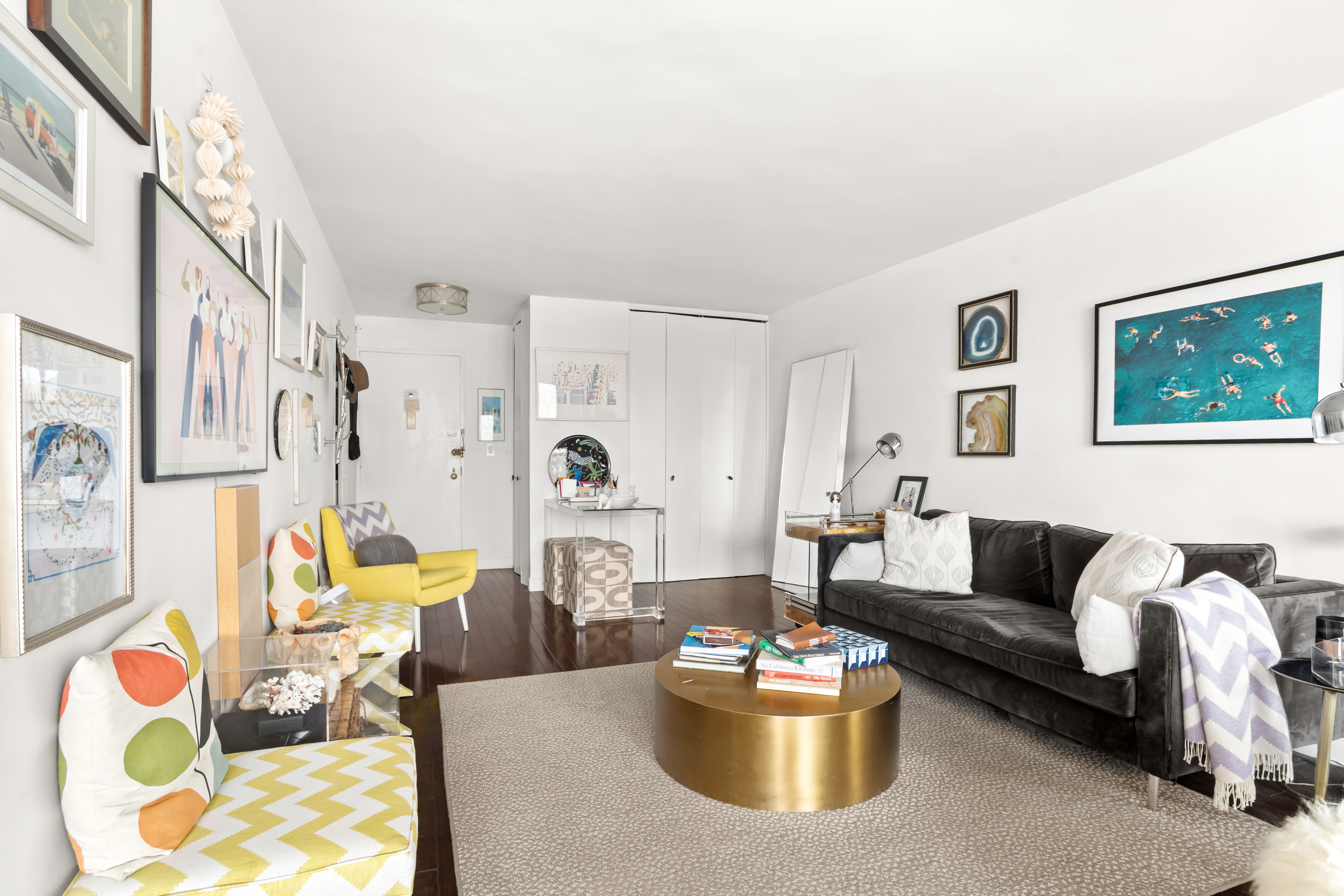 363 East 76th Street, Unit 14E Manhattan, NY 10021 - Photo 3 of 12 a living room with furniture and a potted plant
