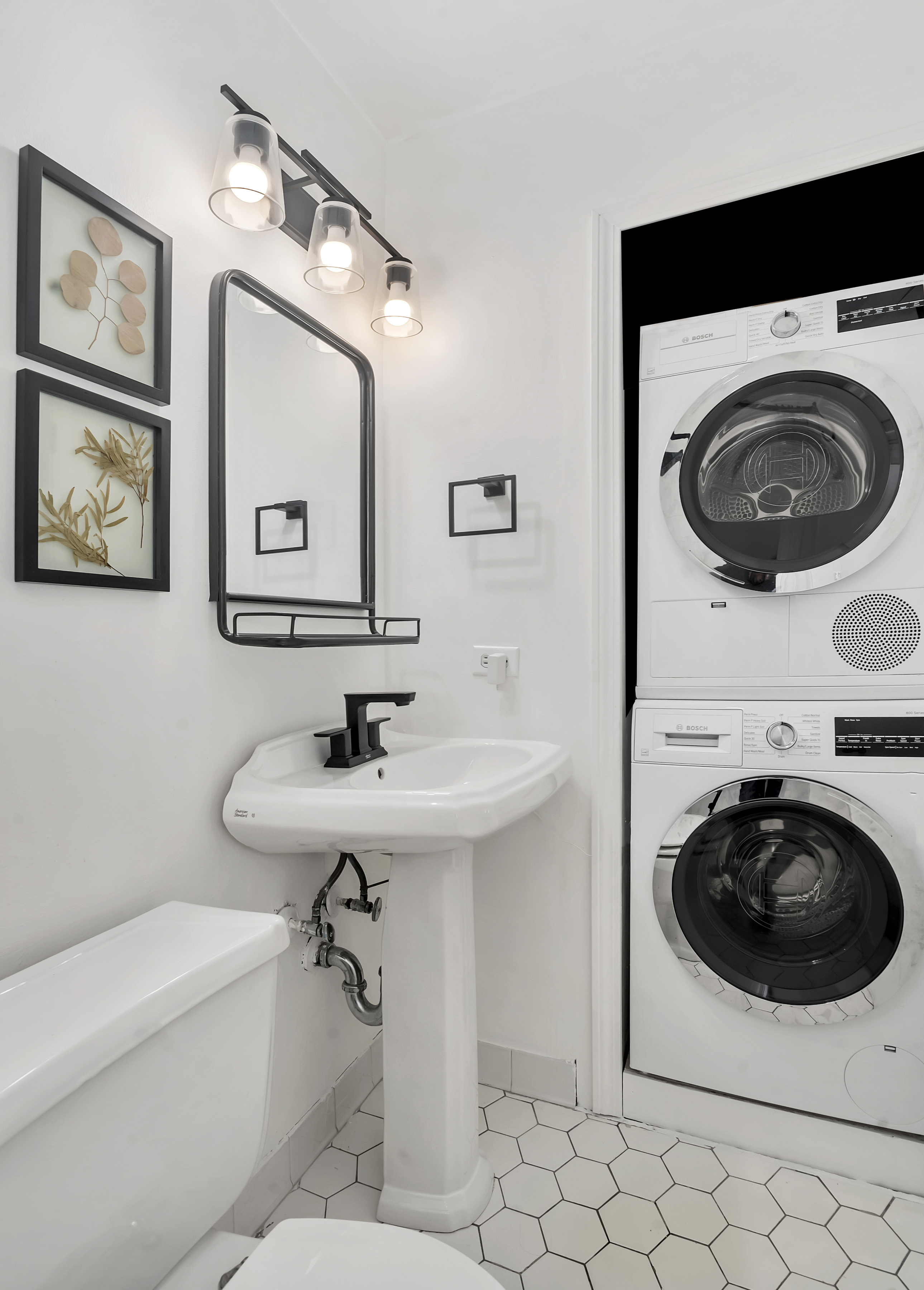255 West 95th Street, Unit 6D Manhattan, NY 10025 - Photo 9 of 16 a bathroom with a sink a toilet and a mirror