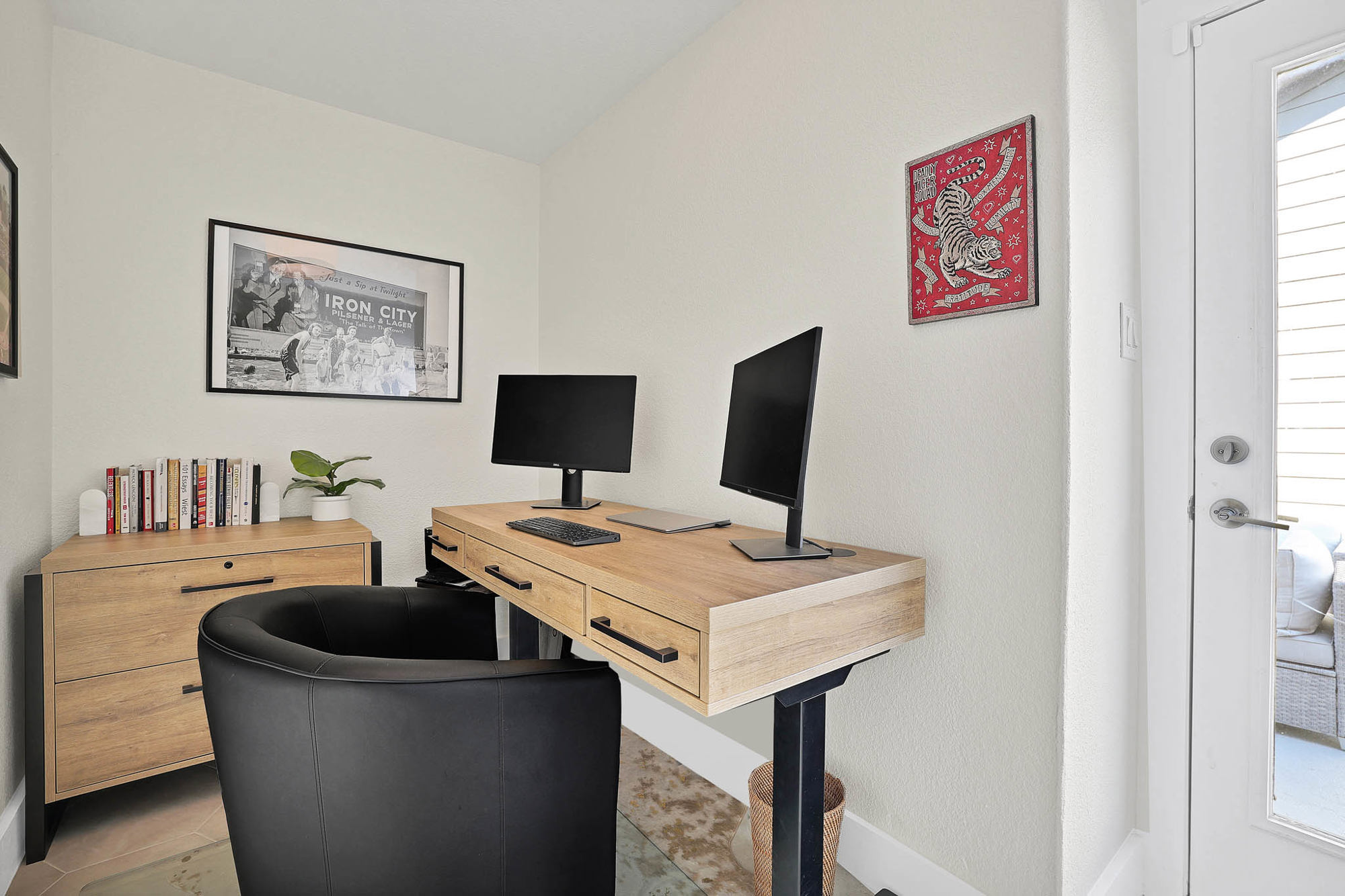 3920 Riesling Ridge Dallas, TX 75204 - Photo 19 of 26 a view of a workspace with furniture and a flat screen tv
