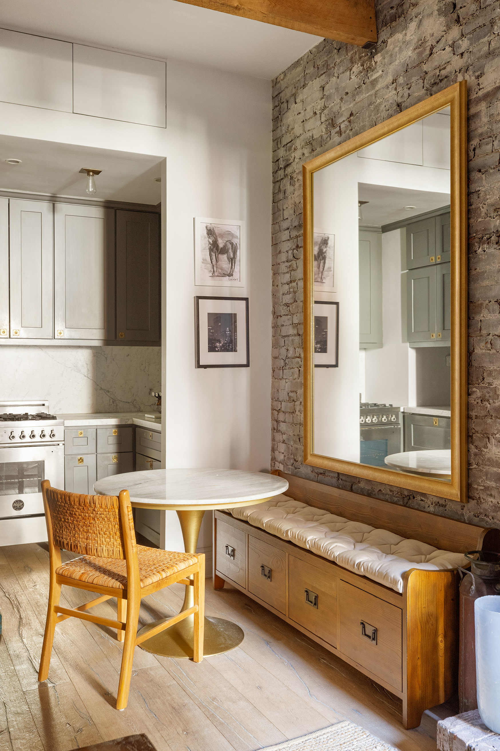 221 West 21st Street, Unit 1C Manhattan, NY 10011 - Photo 4 of 9 a living room with stainless steel appliances kitchen island granite countertop furniture and a window