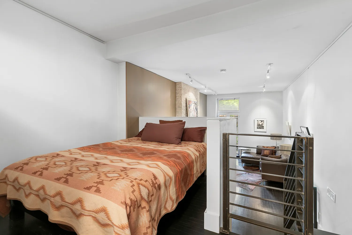 a bedroom with a bed and dresser