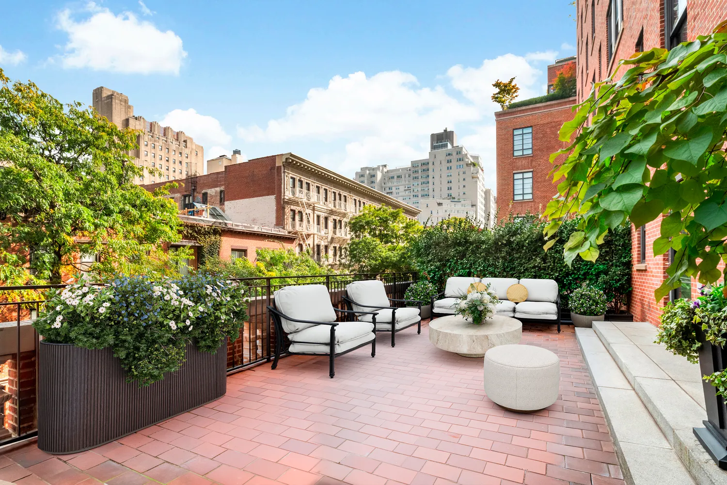 a swimming pool with outdoor seating and plants