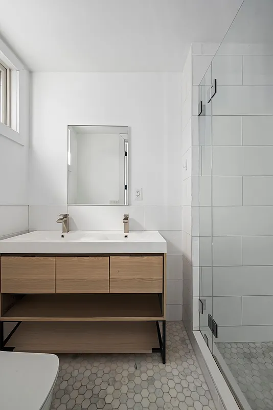 1316 Jefferson Avenue, Unit 2 Brooklyn, NY 11221 - Photo 7 of 10 a bathroom with a sink and mirror