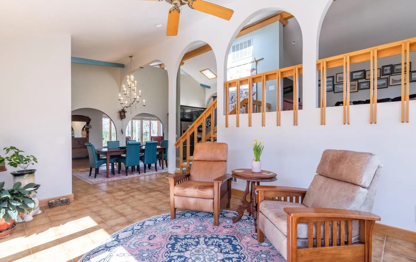 a living room with furniture and a dining table