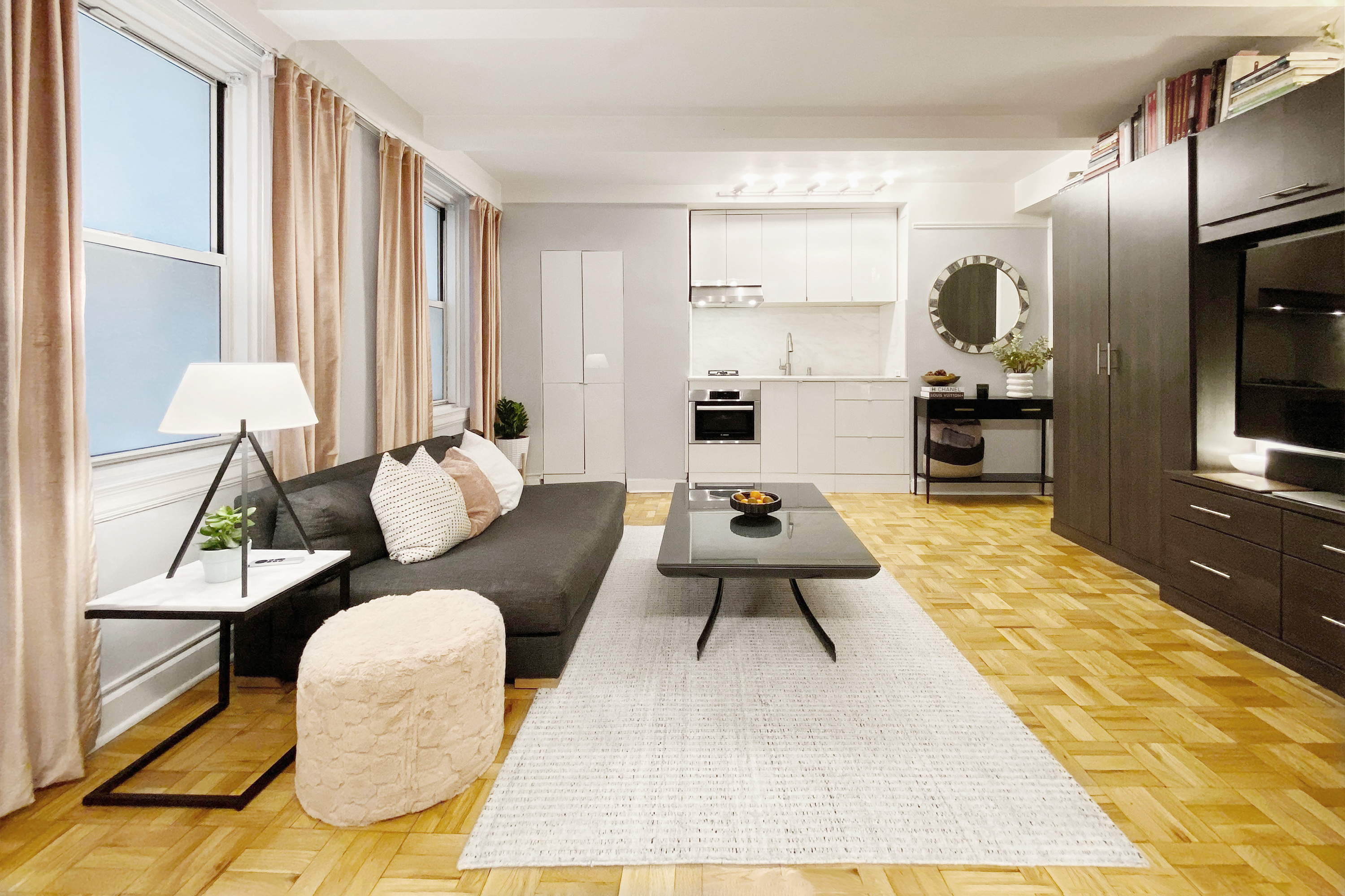 a living room with furniture and a rug